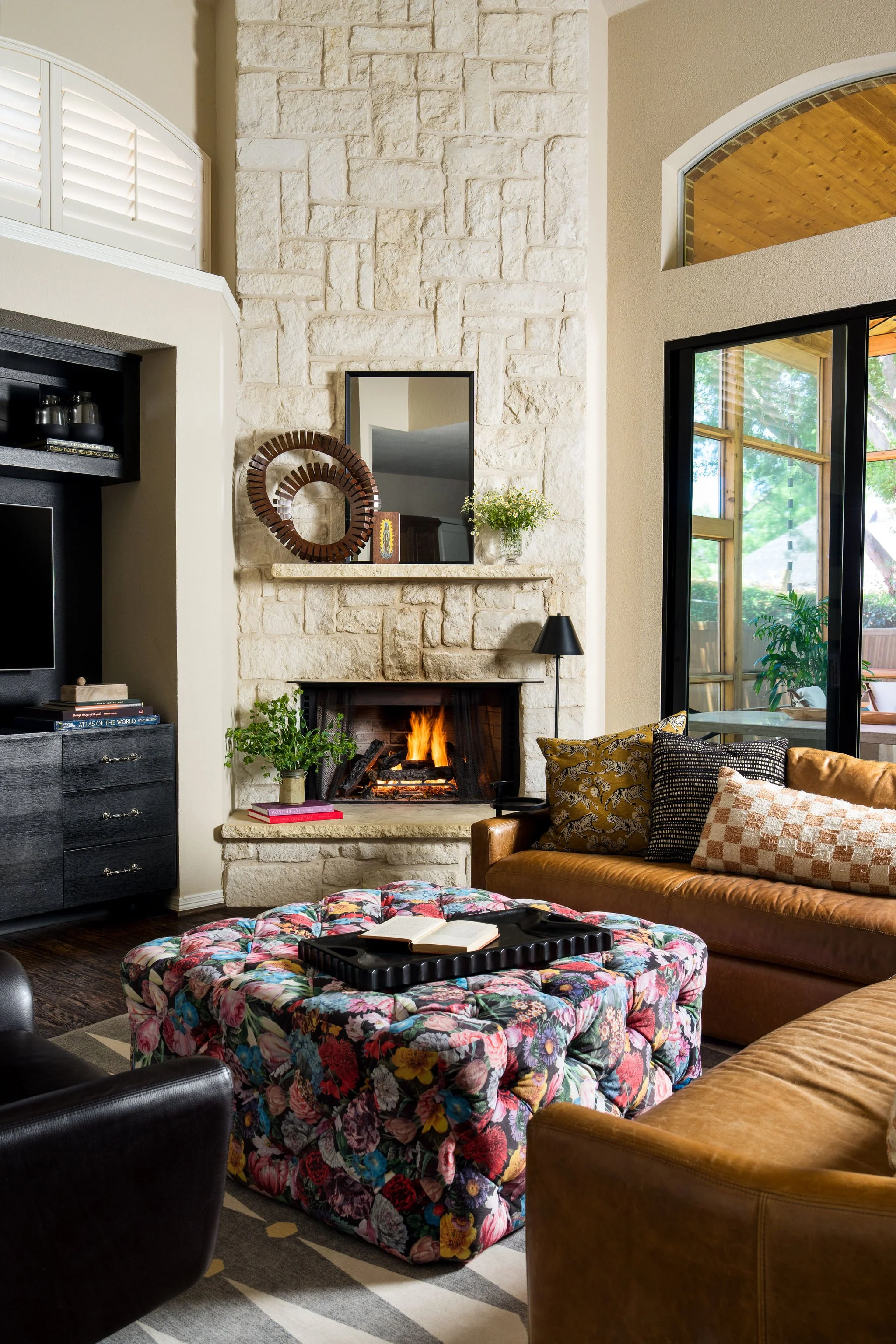 Gorgeous living room interior design with bold colors and leather couch 