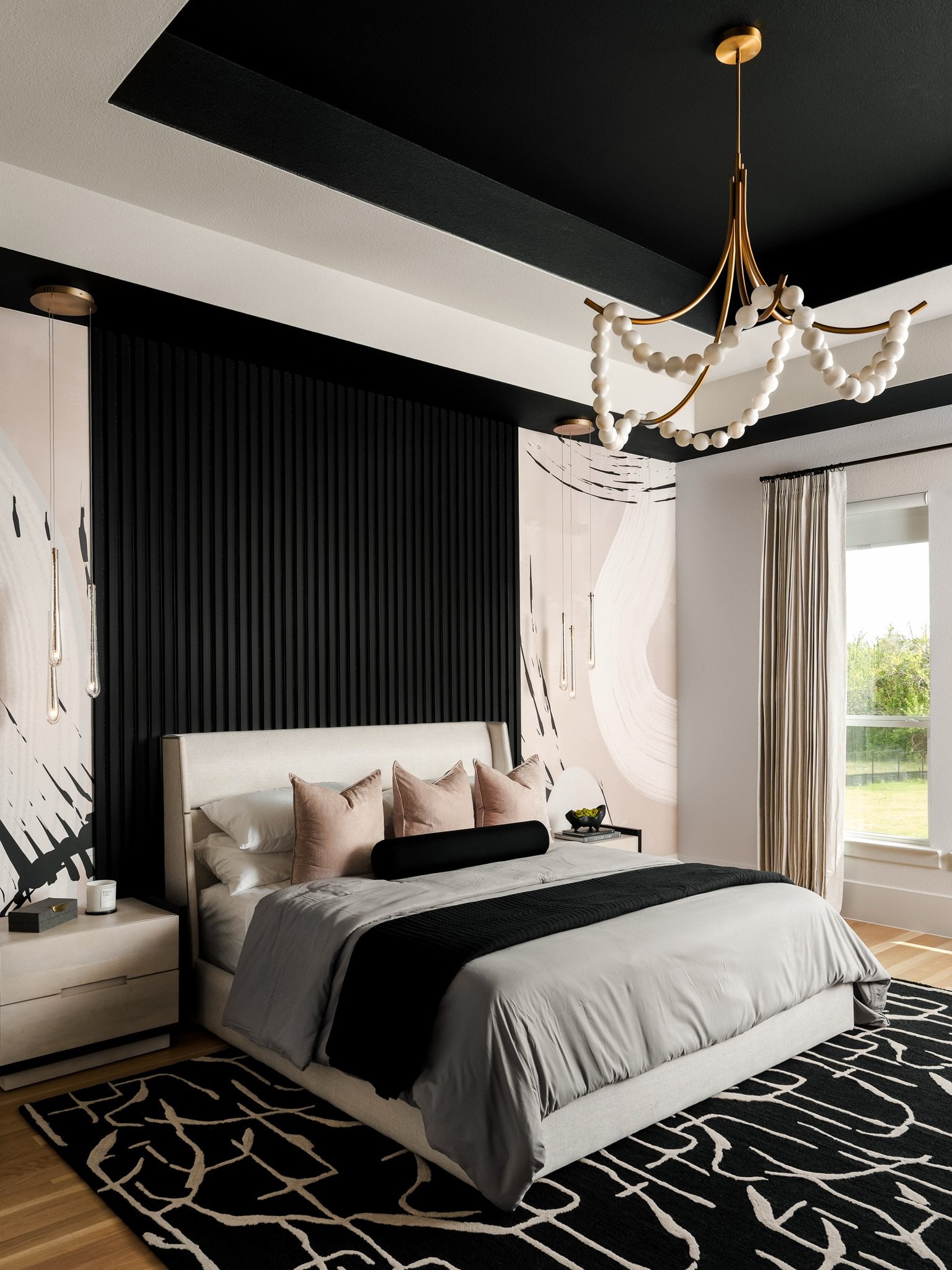 Layered texture and bold contrast in this beautiful bedroom design from the dynamic duo @travispernellinteriors and @keainteriors . From the sculptural lighting to the graphic wall treatment, every element works together to create a space that&rsquo;