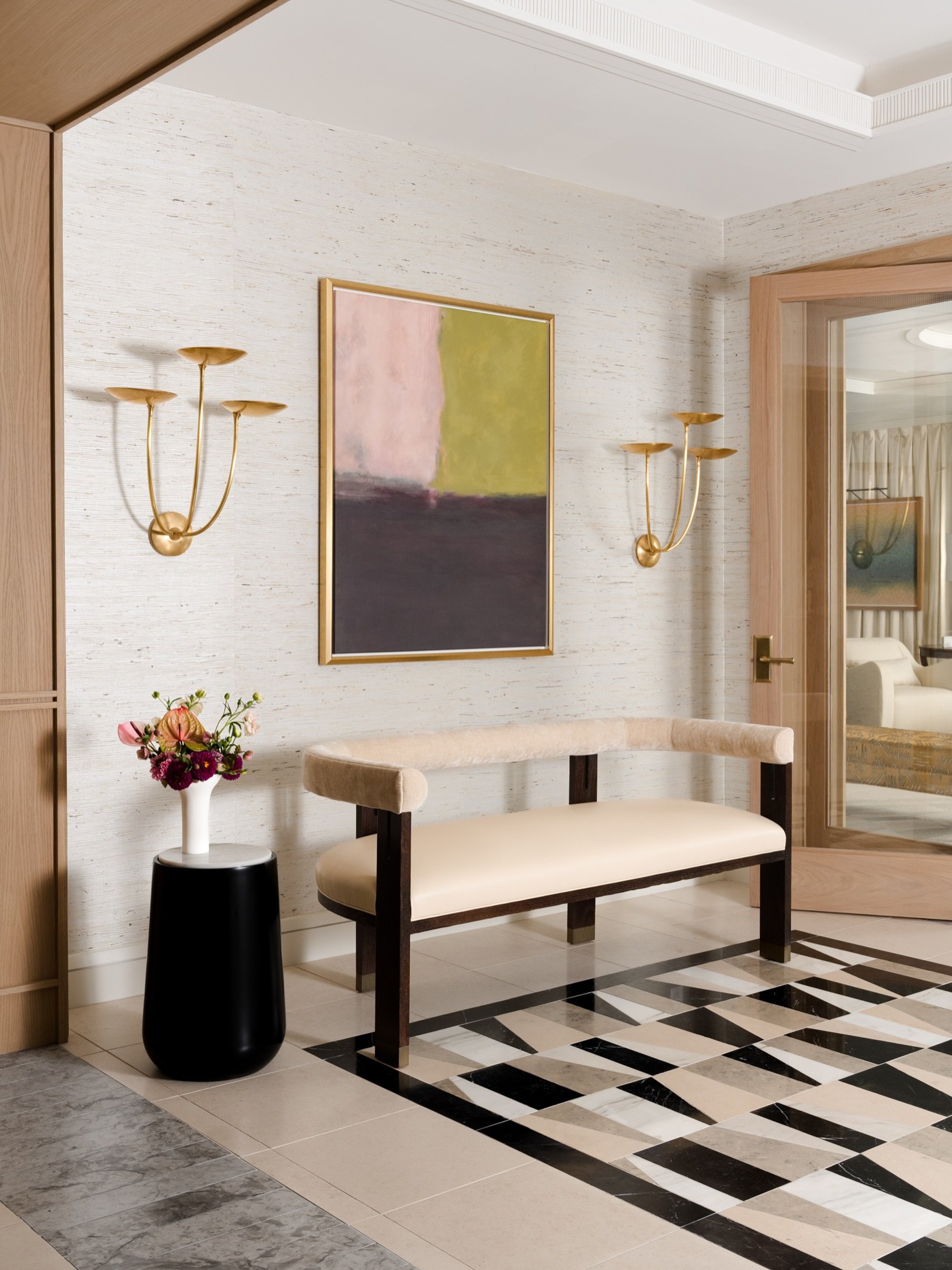 I&rsquo;m a sucker for a bold floor, and this one understood the assignment.

Inside this hospitality-inspired amenity space in Turtle Creek, @v3atelier paired that graphic black-and-white stone with soft oak, creamy upholstery, and warm brass.

Don&