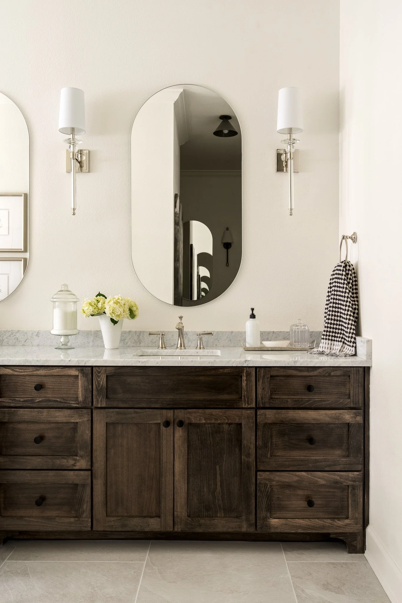 Bright cottage bathroom with traditional vanity and rustic details in Austin home.