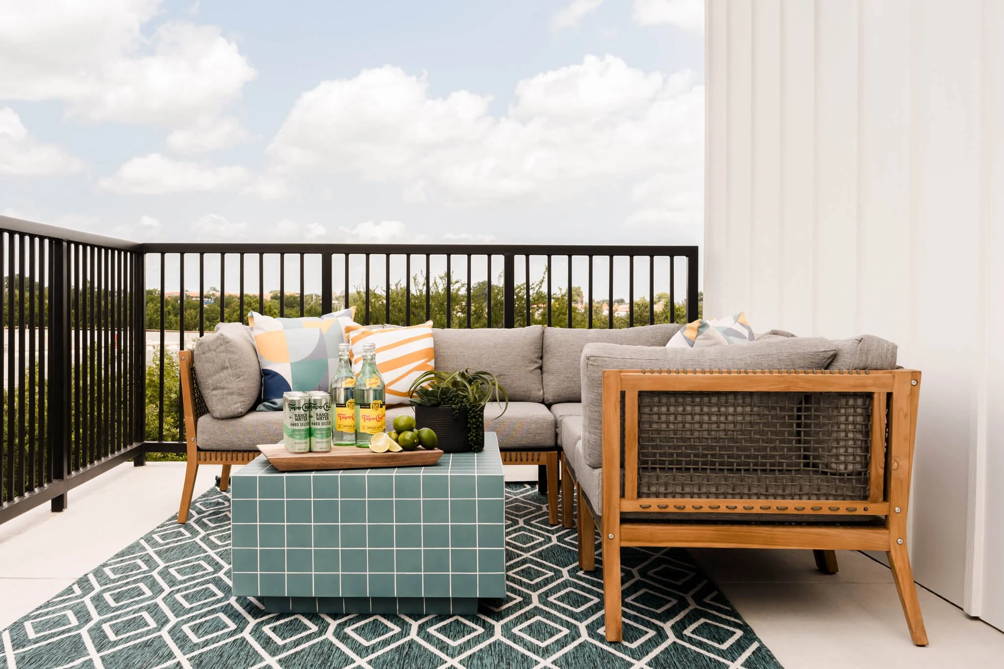 Outdoor multifamily patio and poolside lounge photographed for apartment community marketing in Dallas–Fort Worth featuring modern outdoor furnishings and resort-style amenities.