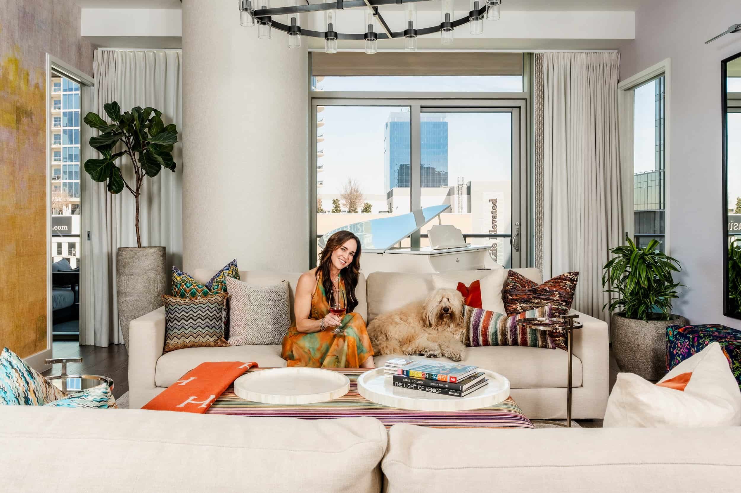 Dallas Commercial Advertising Photographer. Neutral living room with female model posing with dog for a textile stain prevention company. photos of dallas