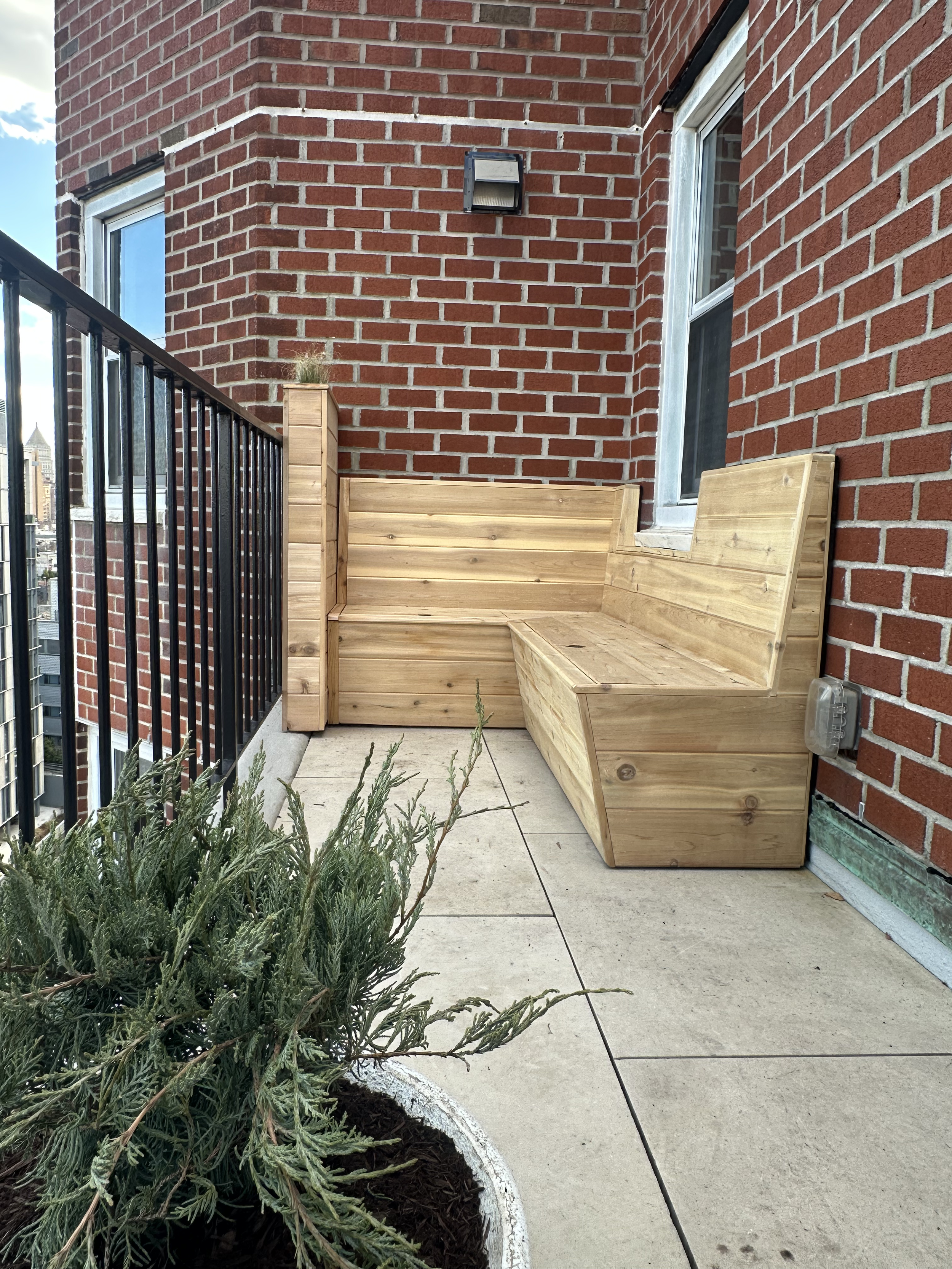 Hand tool with a metal head and wooden handle, likely a hammer.