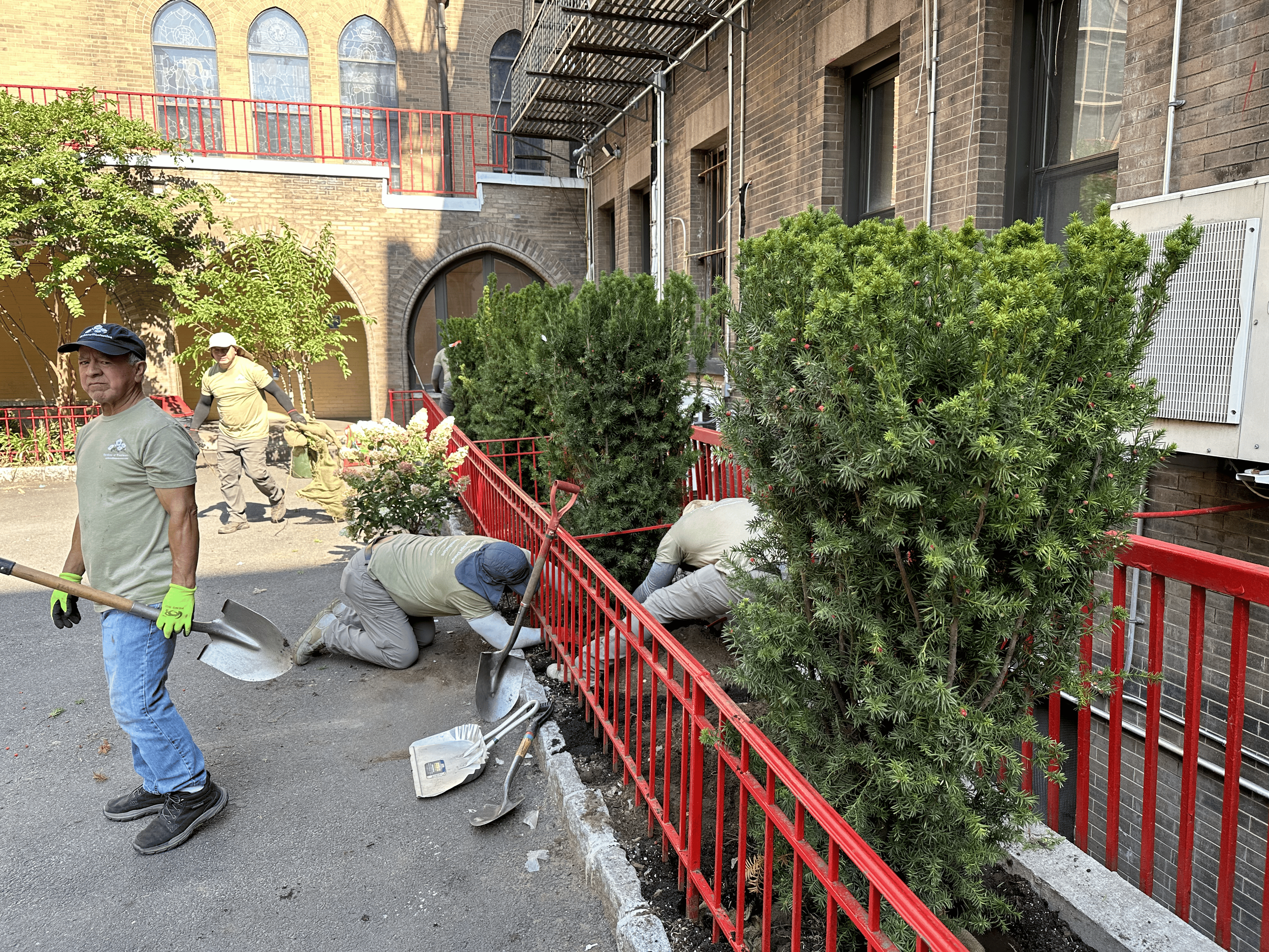 A small gardening shovel with a metal handle and a white cloth coated tip.
