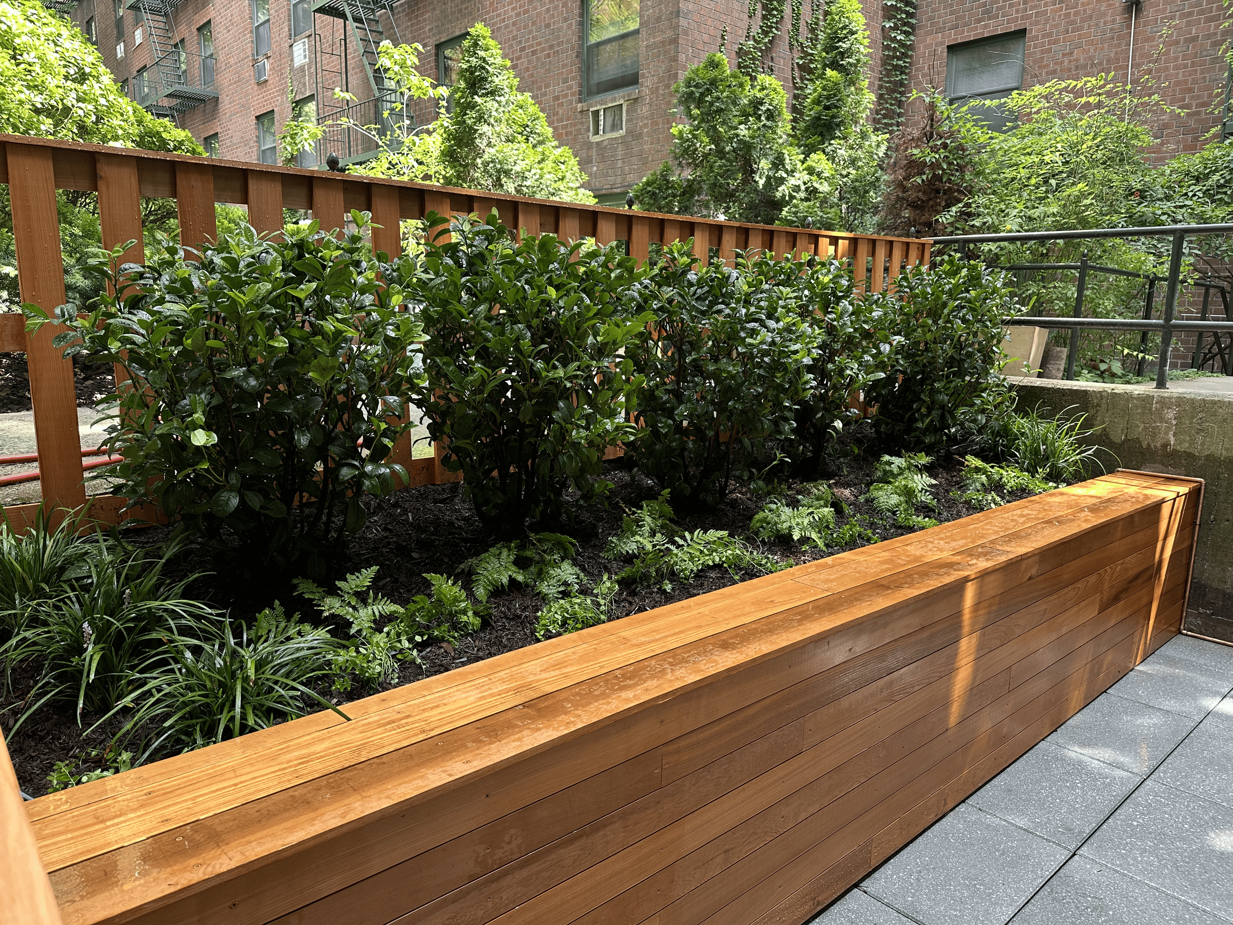 Hand tool with a metal head and wooden handle, likely a hammer.