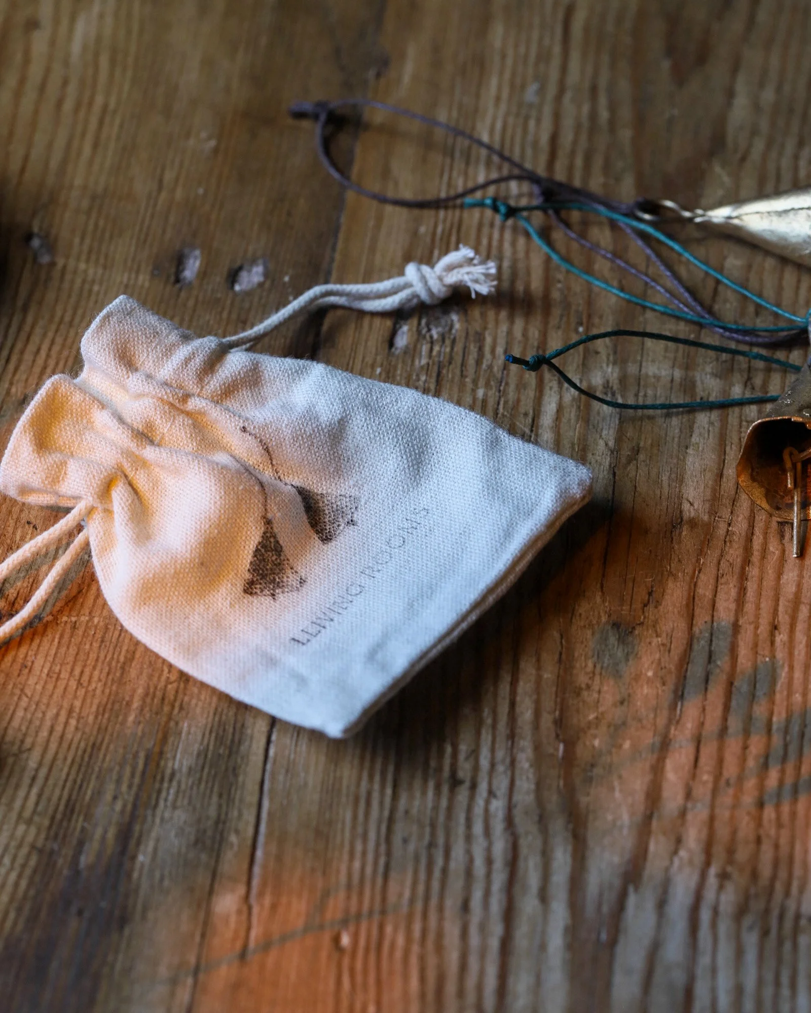 A set of four rustic bells with cotton gift bag