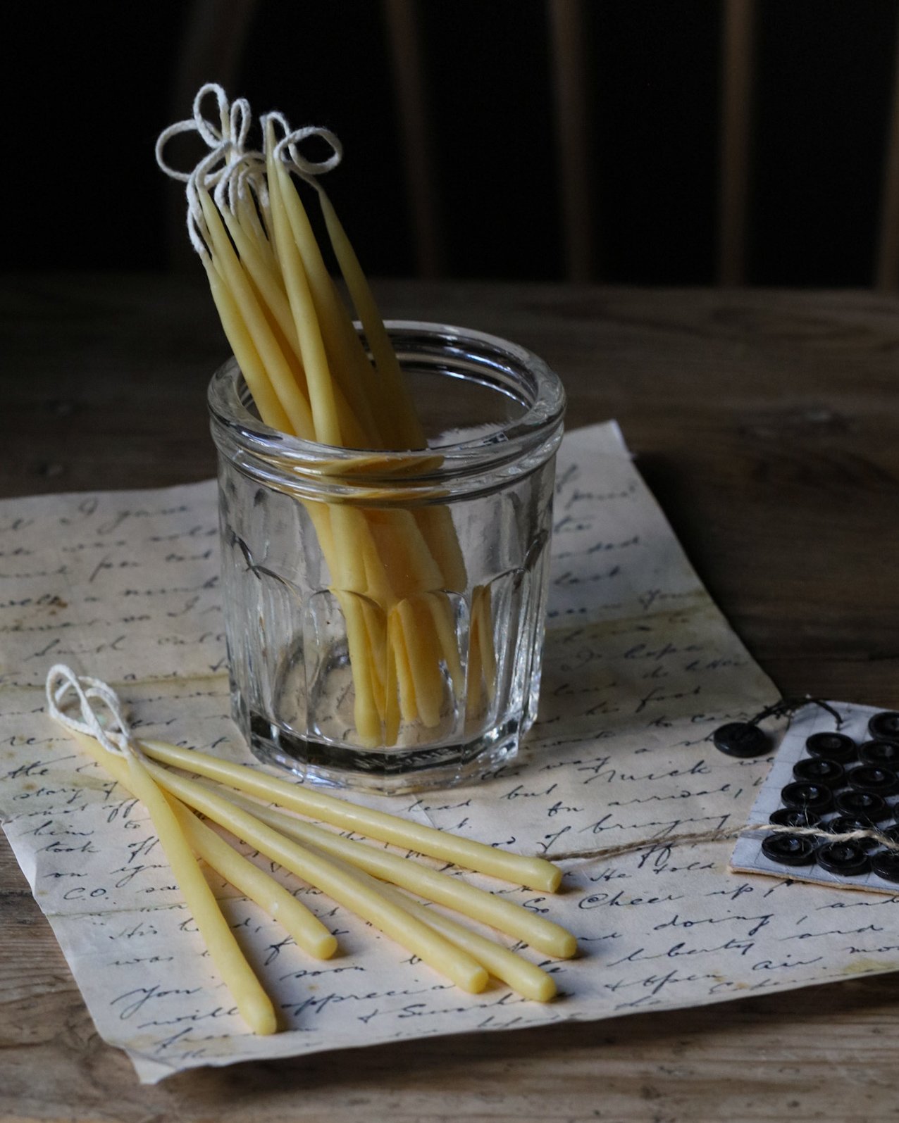 Beeswax birthday candles in a rustic setting