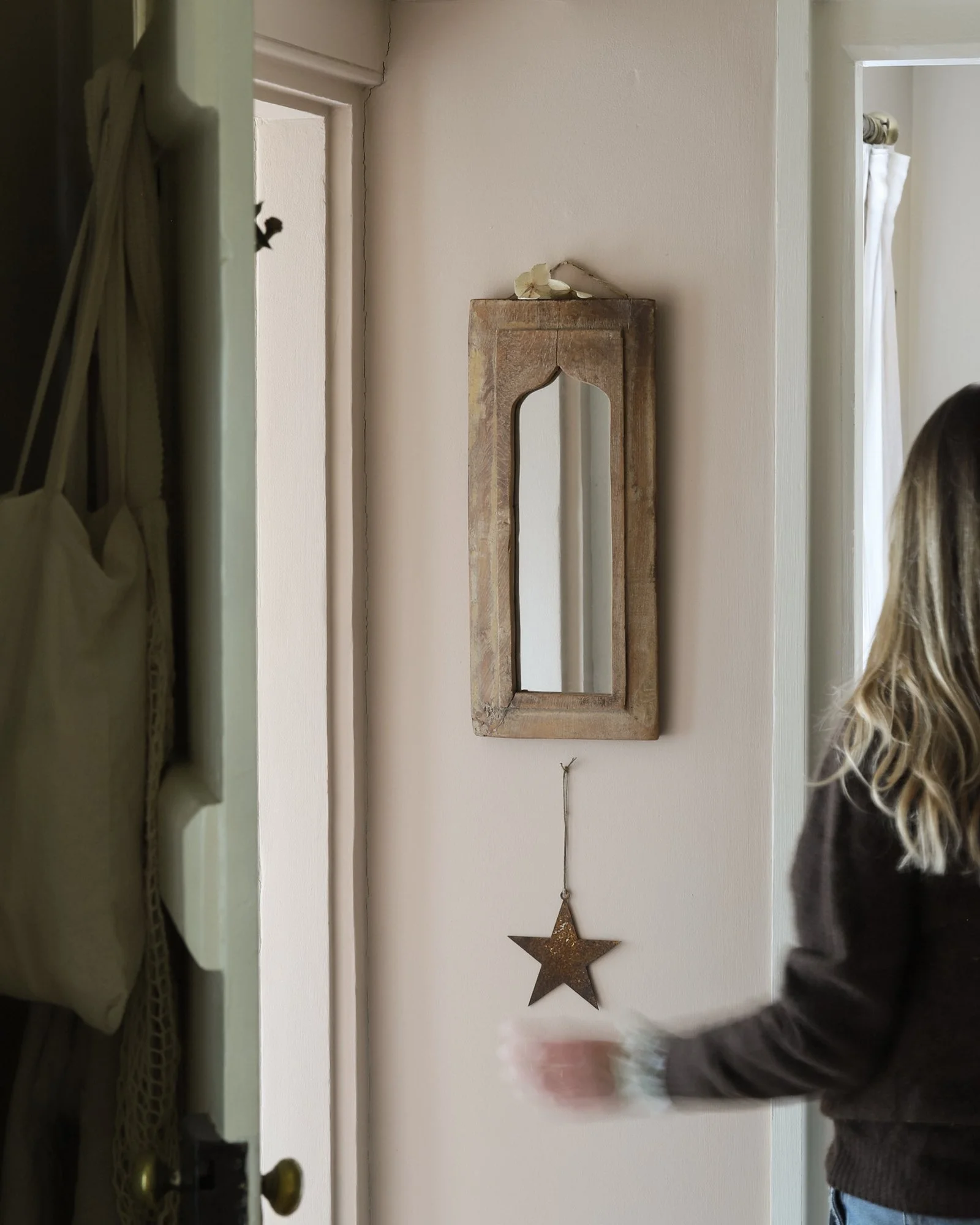 A rusty decorative star hanging in a cottage