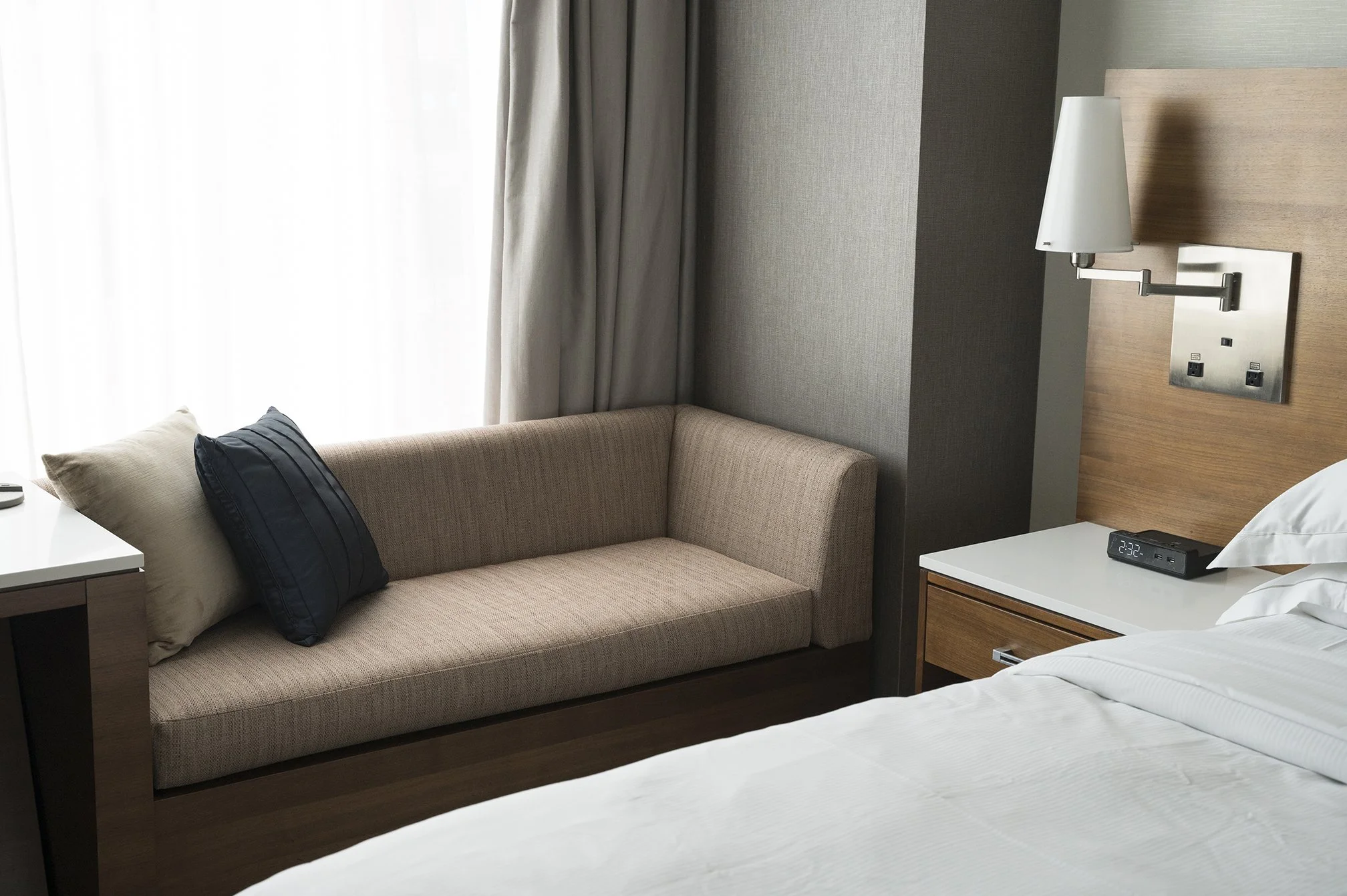 Custom upholstered banquette seating in hotel dining room, built for high-traffic commercial use