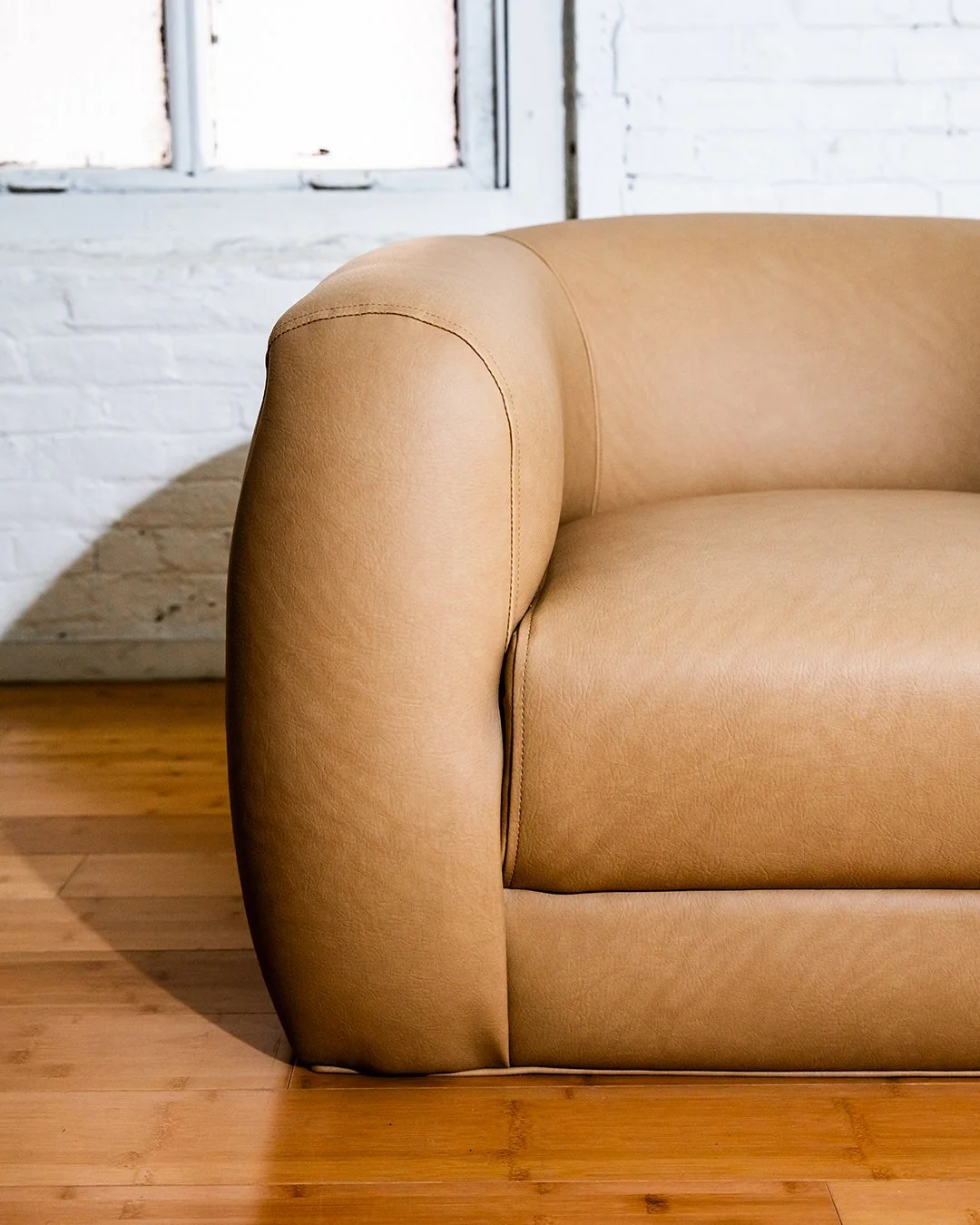 web-brown-armchair-custom-curved-2025.09.03_FortnerFinishedRoom_Selects-15.jpg