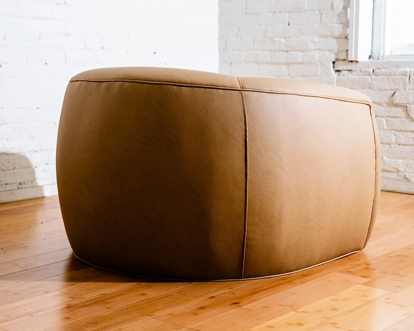web-brown-armchair-custom-curved-2025.09.03_FortnerFinishedRoom_Selects-22.jpg