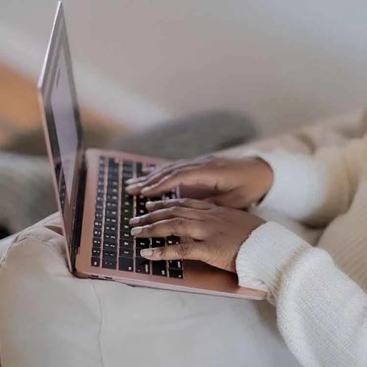 Business owner working on a laptop before a discovery call