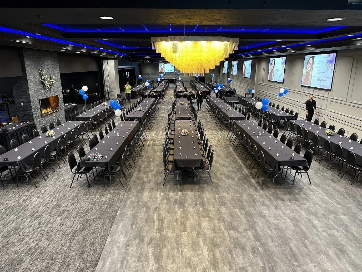 Graduation ceremony setup at Stadium View Event Halls in Green Bay with rows of banquet seating and stage area.