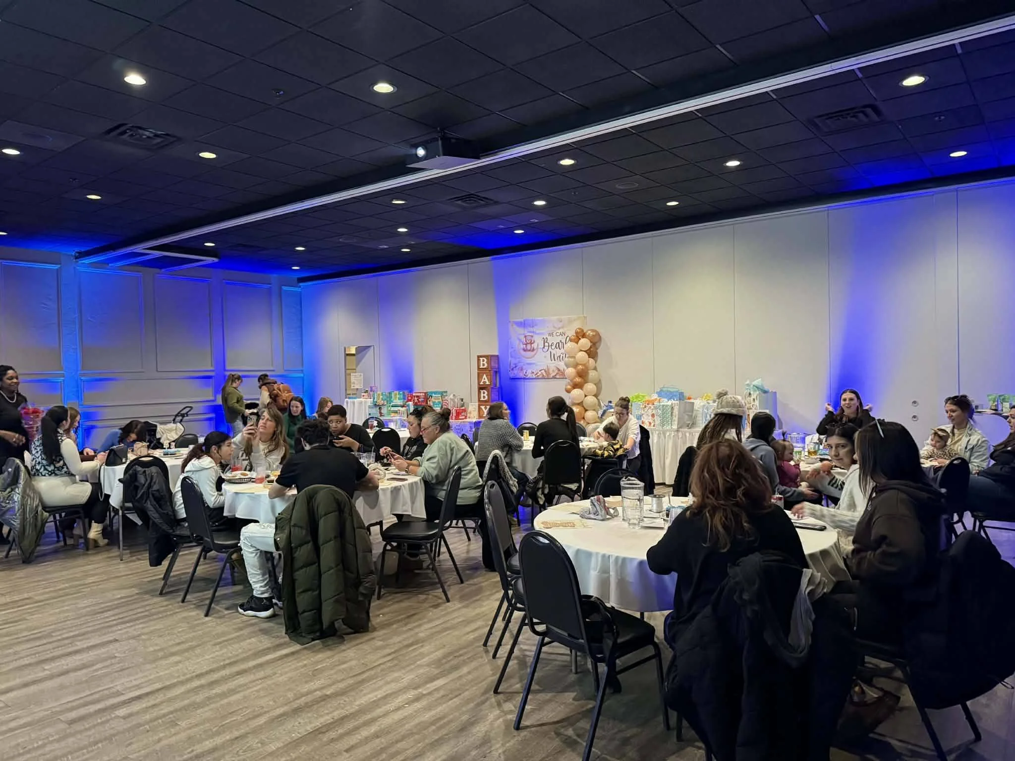 Baby shower setup at Stadium View Event Halls in Green Bay with decorated banquet tables and guest seating.