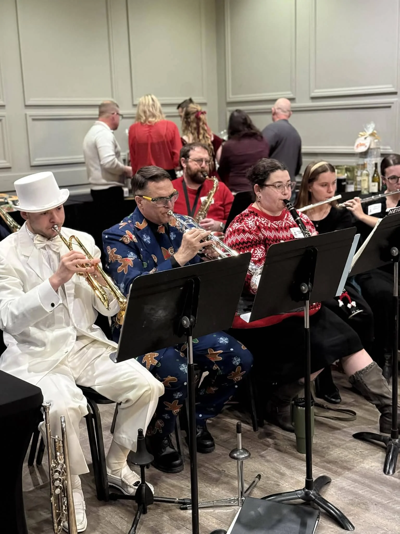 Holiday party guests enjoying a warm, elegant event space