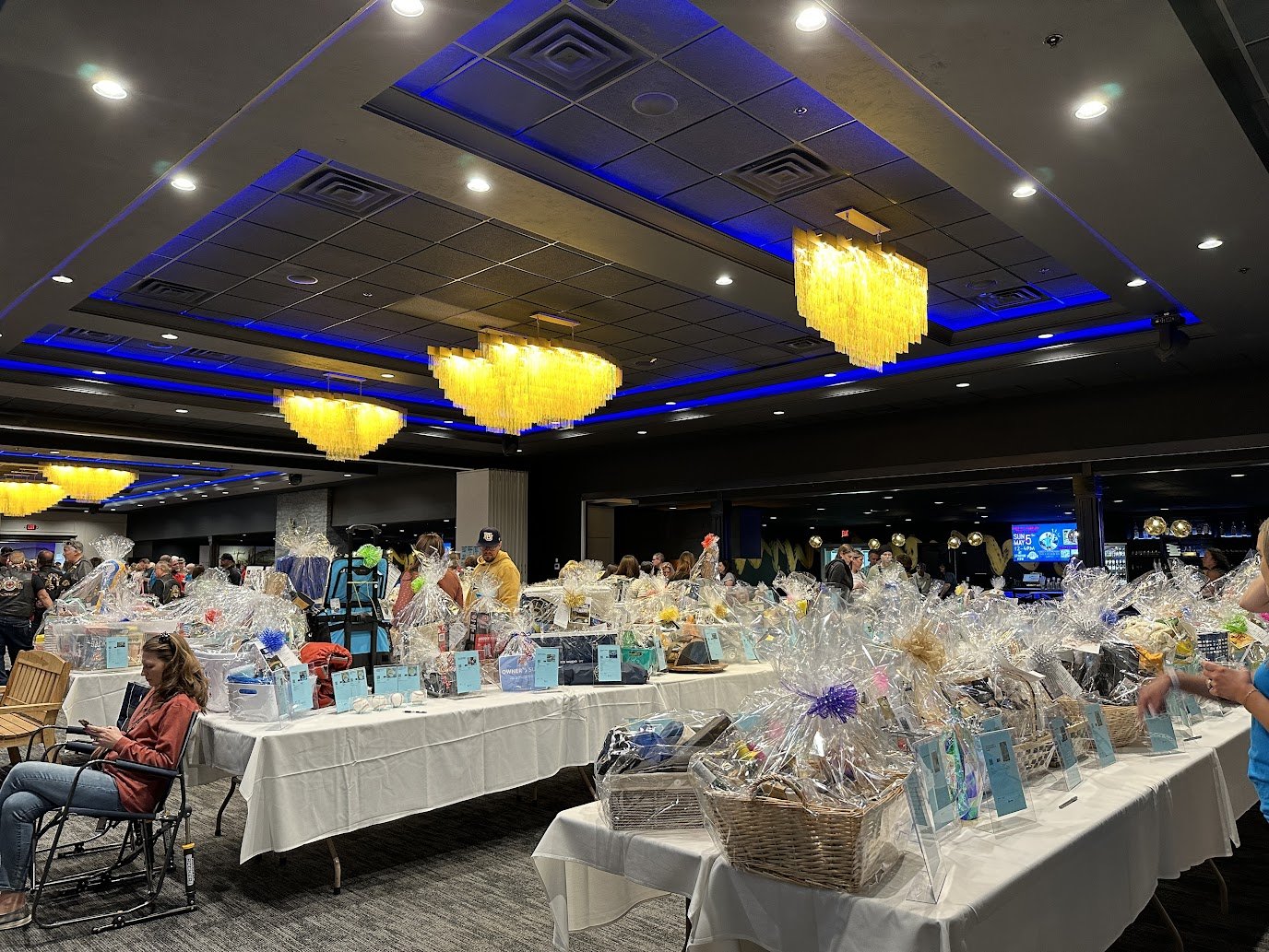 Charity raffle baskets arranged for a fundraiser event near Lambeau Field.