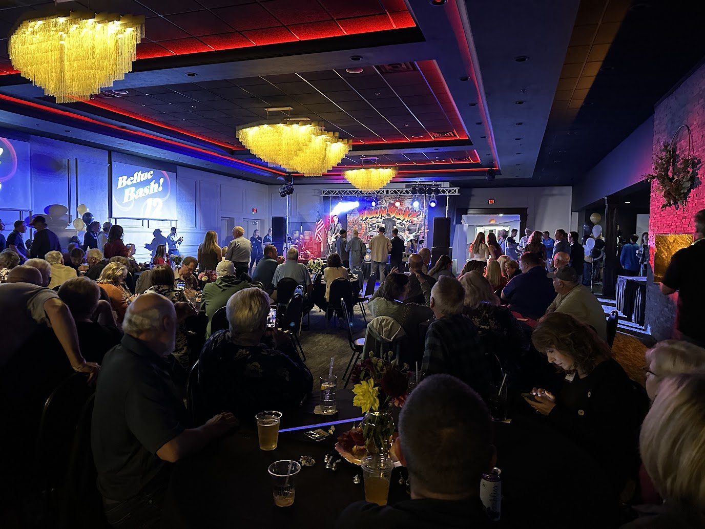 A lively audience enjoying an unforgettable concert experience in Green Bay