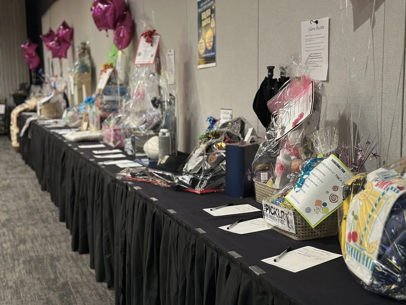 Fundraising raffle station encouraging guest participation at Stadium View Event Halls.