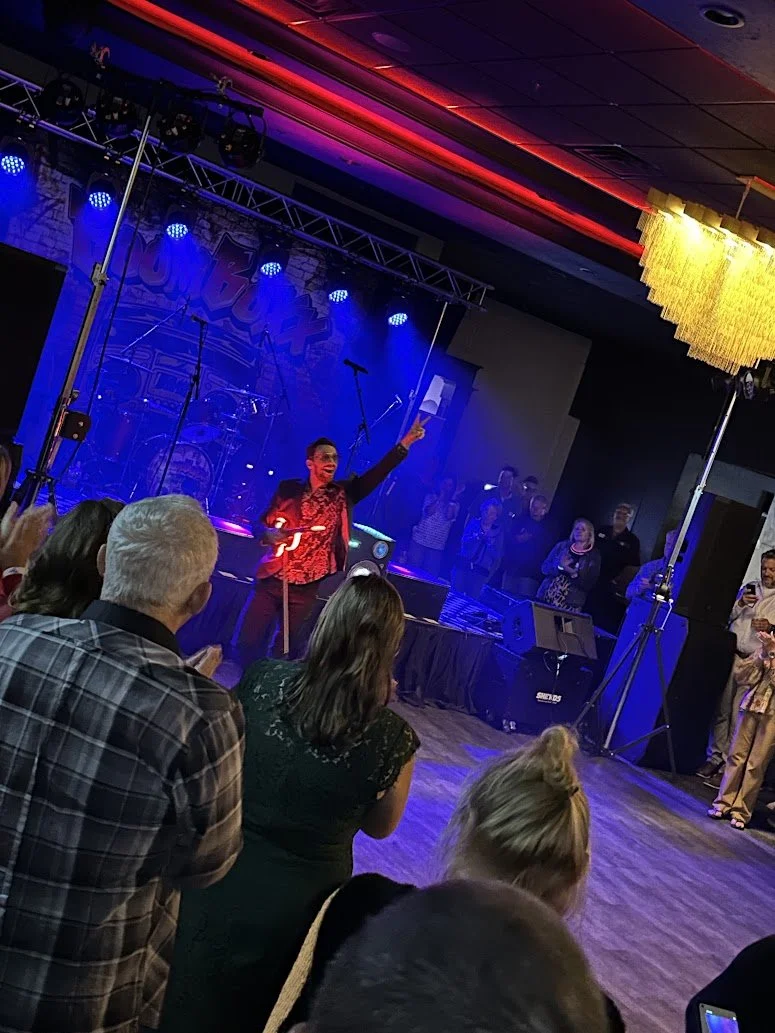 Friends enjoying live music and drinks at Stadium View Event Halls concert venue