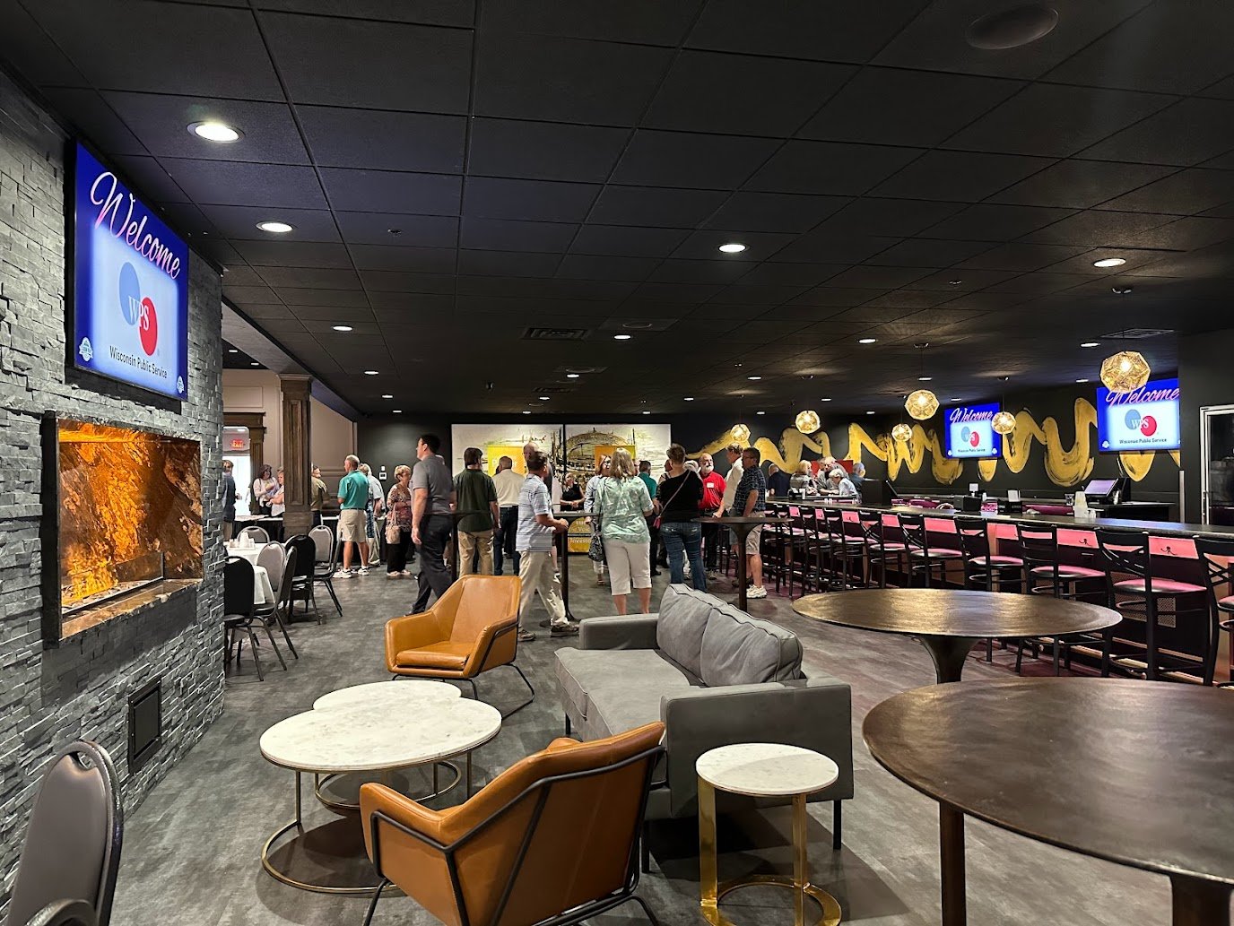 Attendees networking during a corporate event in a Green Bay banquet hall at Stadium View.