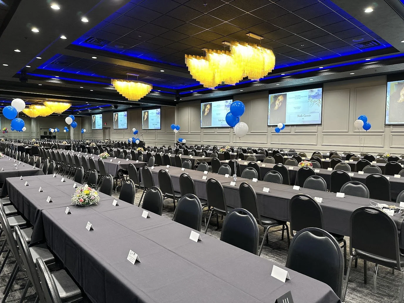 Banquet-style seating arranged for a graduation celebration at Stadium View Event Halls