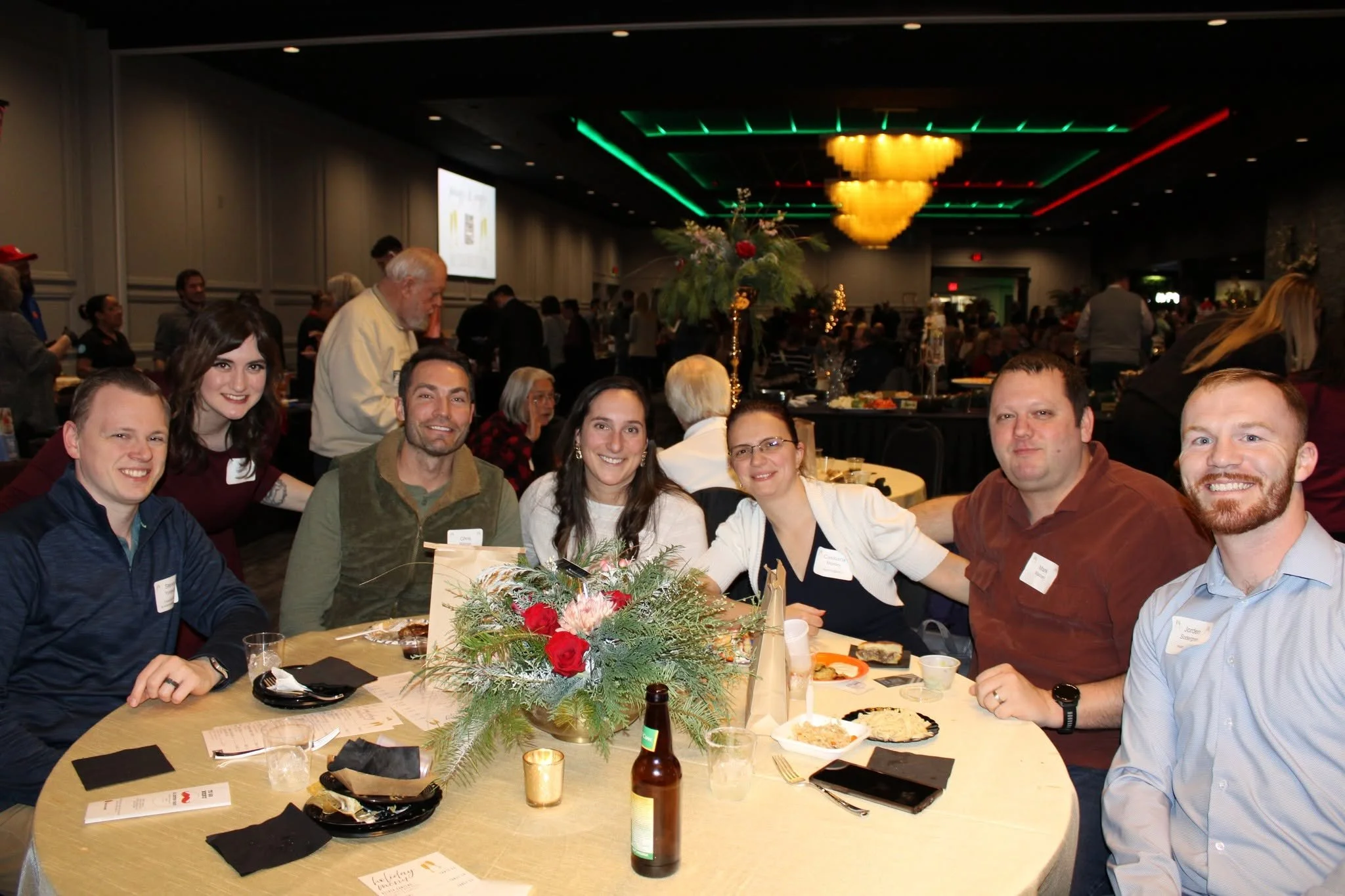 a group of collegues from discover green bay enjoying their holiday party reception at stadium view event halls