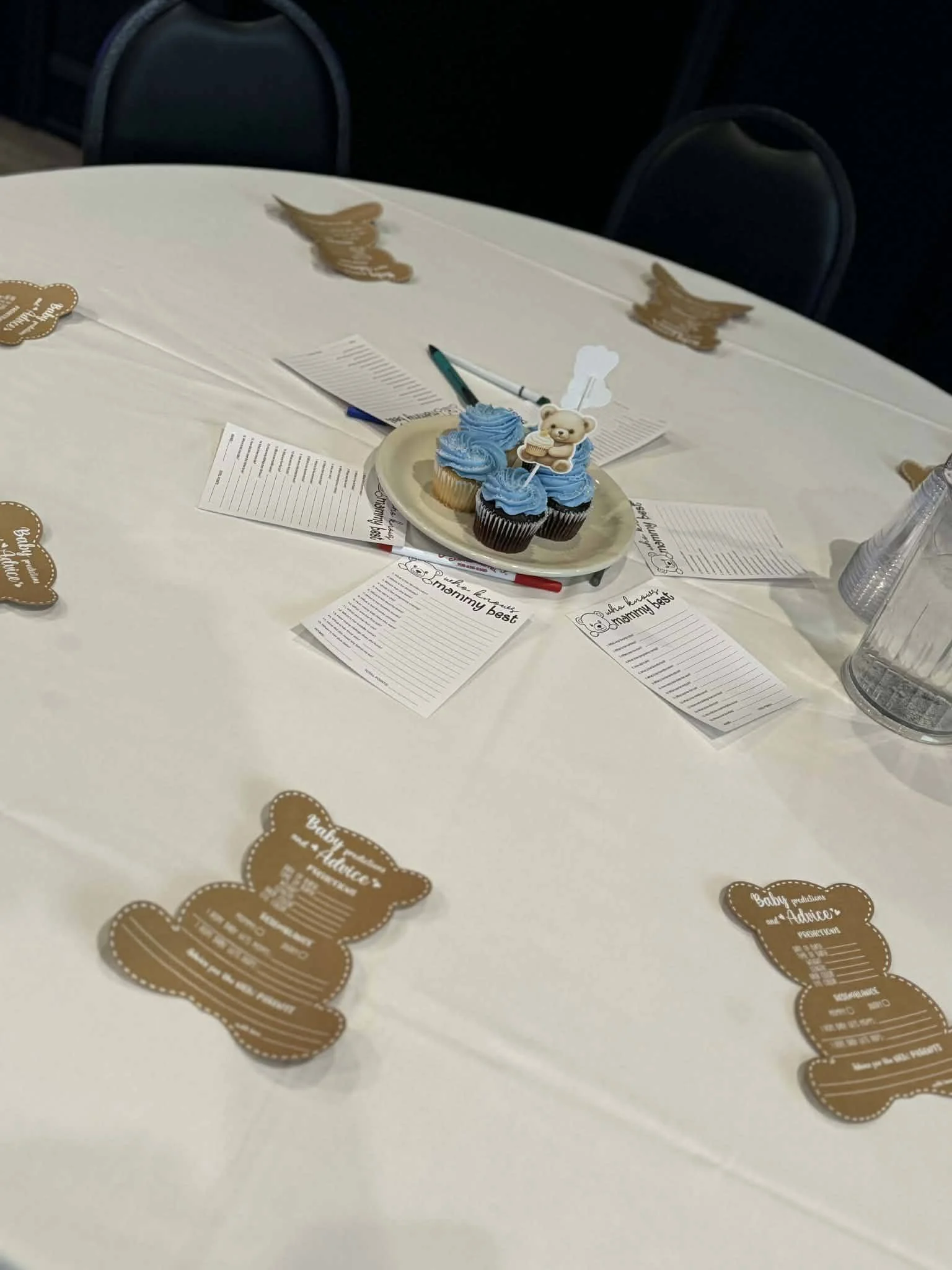 Decorated event hall for a baby shower celebration featuring balloons, flowers, and themed décor.