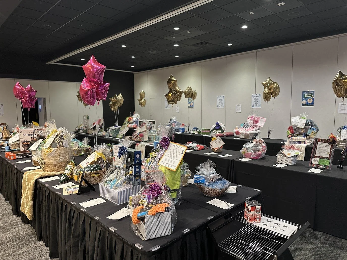 Close-up of raffle baskets supporting a fundraising event at Stadium View Event Halls.