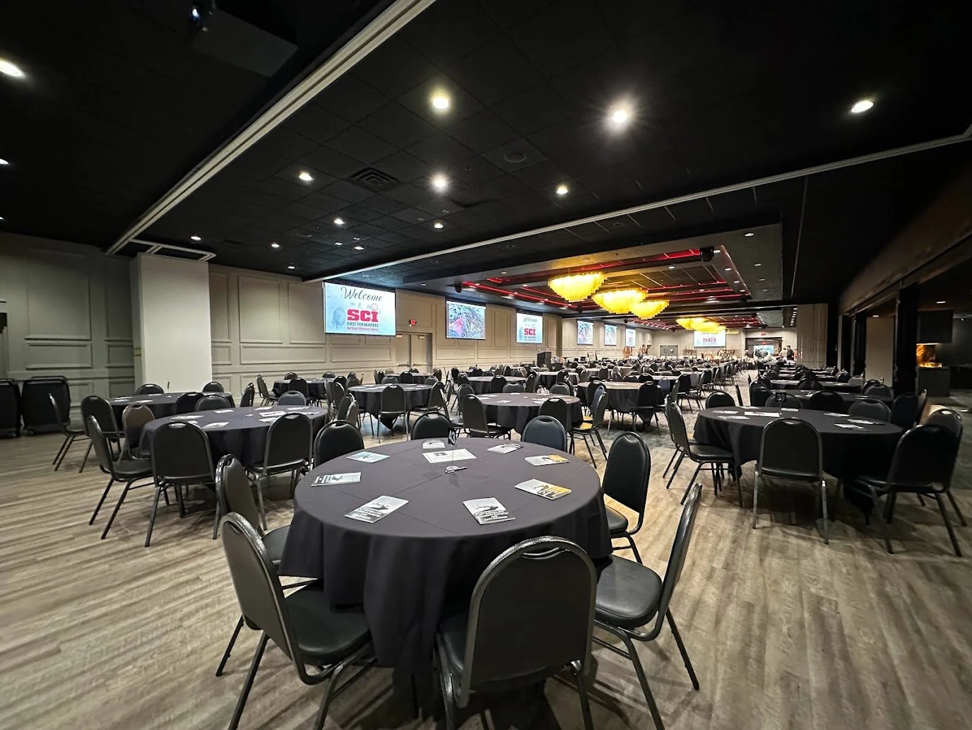 Professional meeting atmosphere with AV equipment and banquet seating at Stadium View Event Halls.