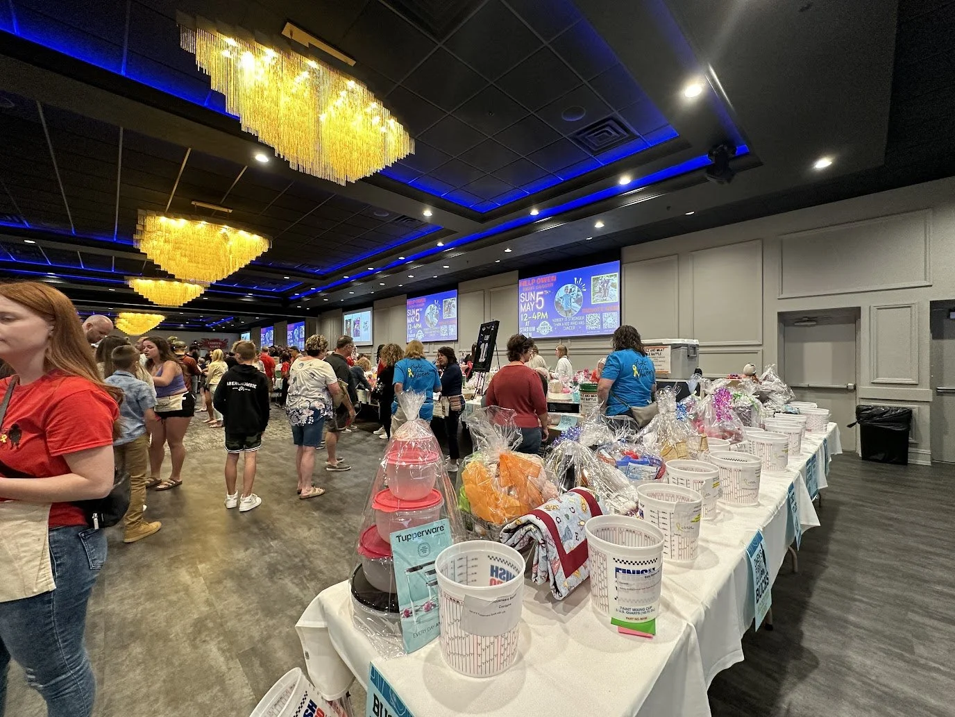 Fundraiser raffle table featuring donated baskets at Stadium View Event Halls.