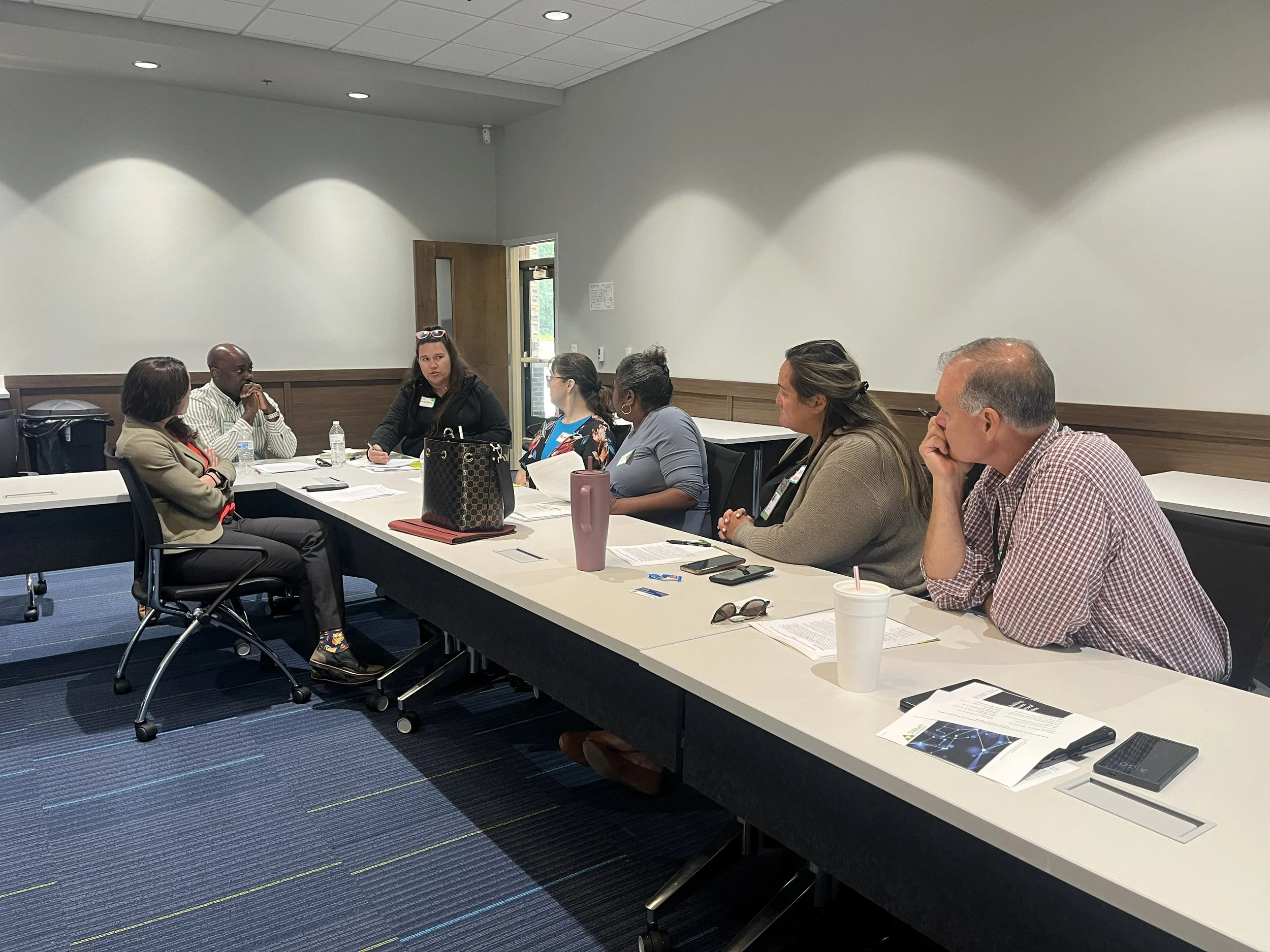 Break out groups working on case studies during a cross-training between specialty mental health probation officers and behavioral health providers.