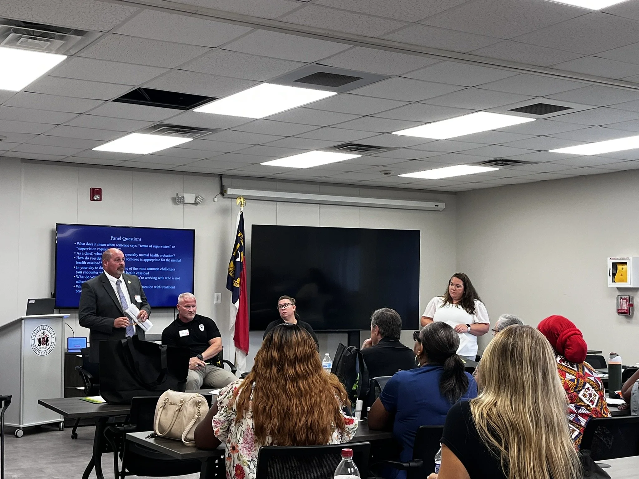 Specialty mental health probation (SMHP) representatives participating in a panel during a cross-training between SMHP officers and behavioral health providers.