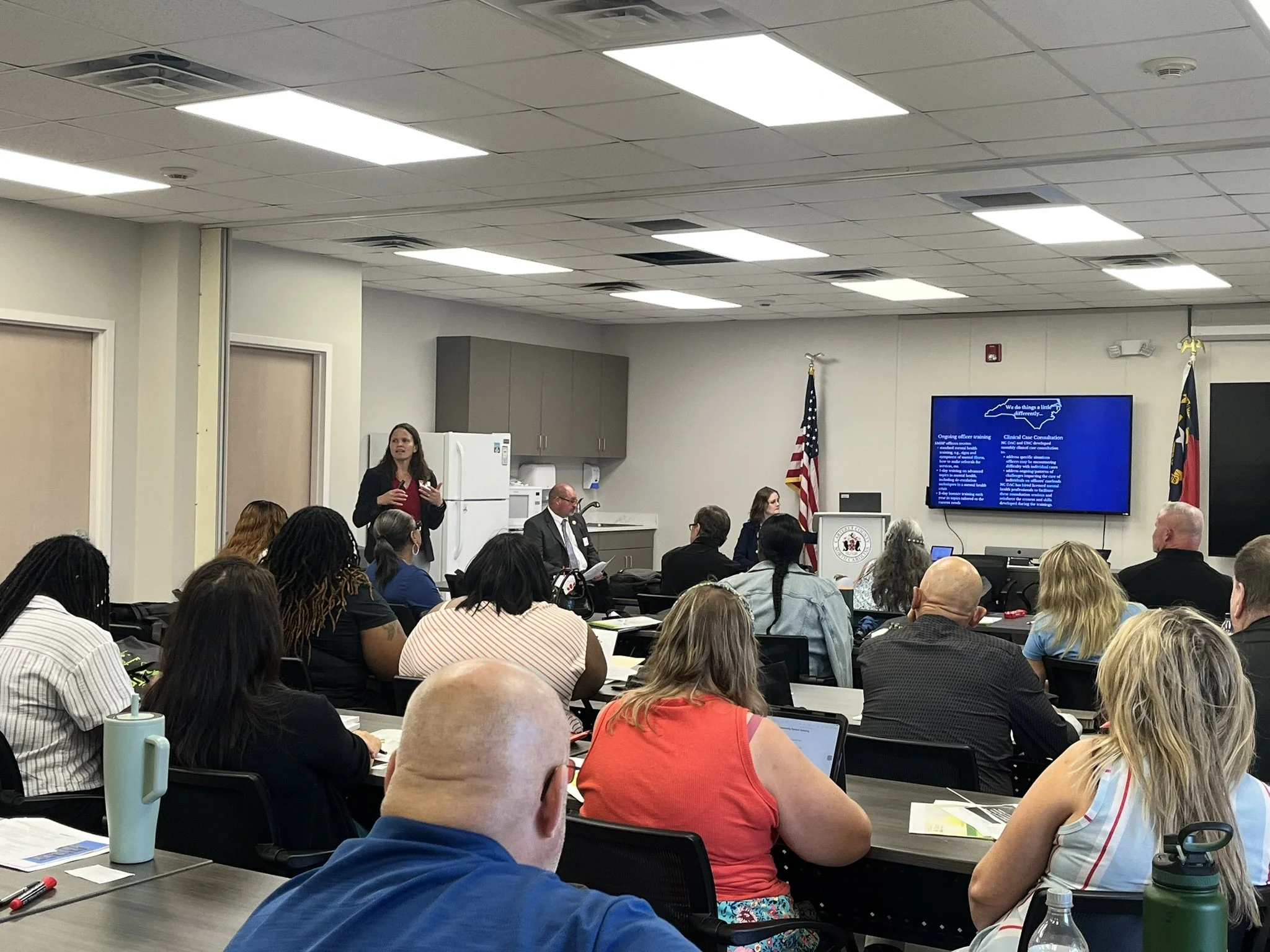 Tonya Van Deinse speaking at a cross-training between SMHP officers and behavioral health providers.