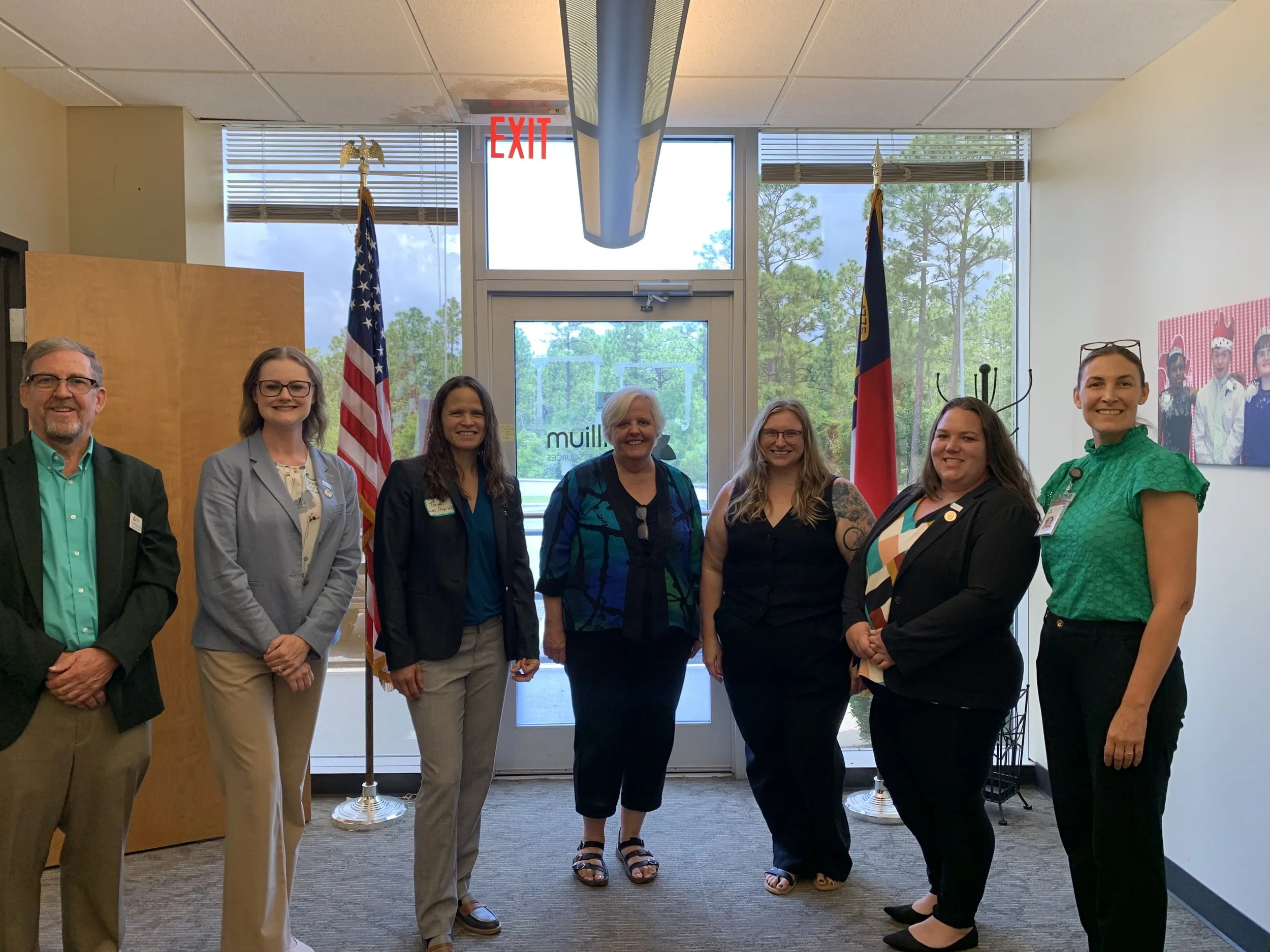 Brian Gates, Ashlee Barnes, Tonya Van Deinse, Marilyn Ghezzi, Julia Metz, Amber Livengood, and Cecilia Peers after hosting the first cross-training between specialty mental health probation officers and behavioral health providers.
