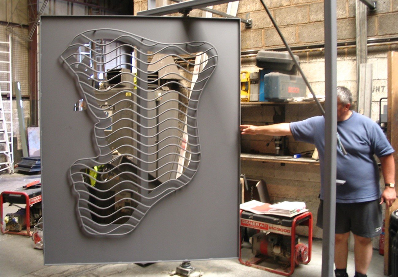 BESPOKE METAL BUILDING ENTRANCE GATE Co-ordination with the fabricators. Barge Arm, Gloucester Docks. Project Architect from inception to completion at Edward Cullinan Architects.