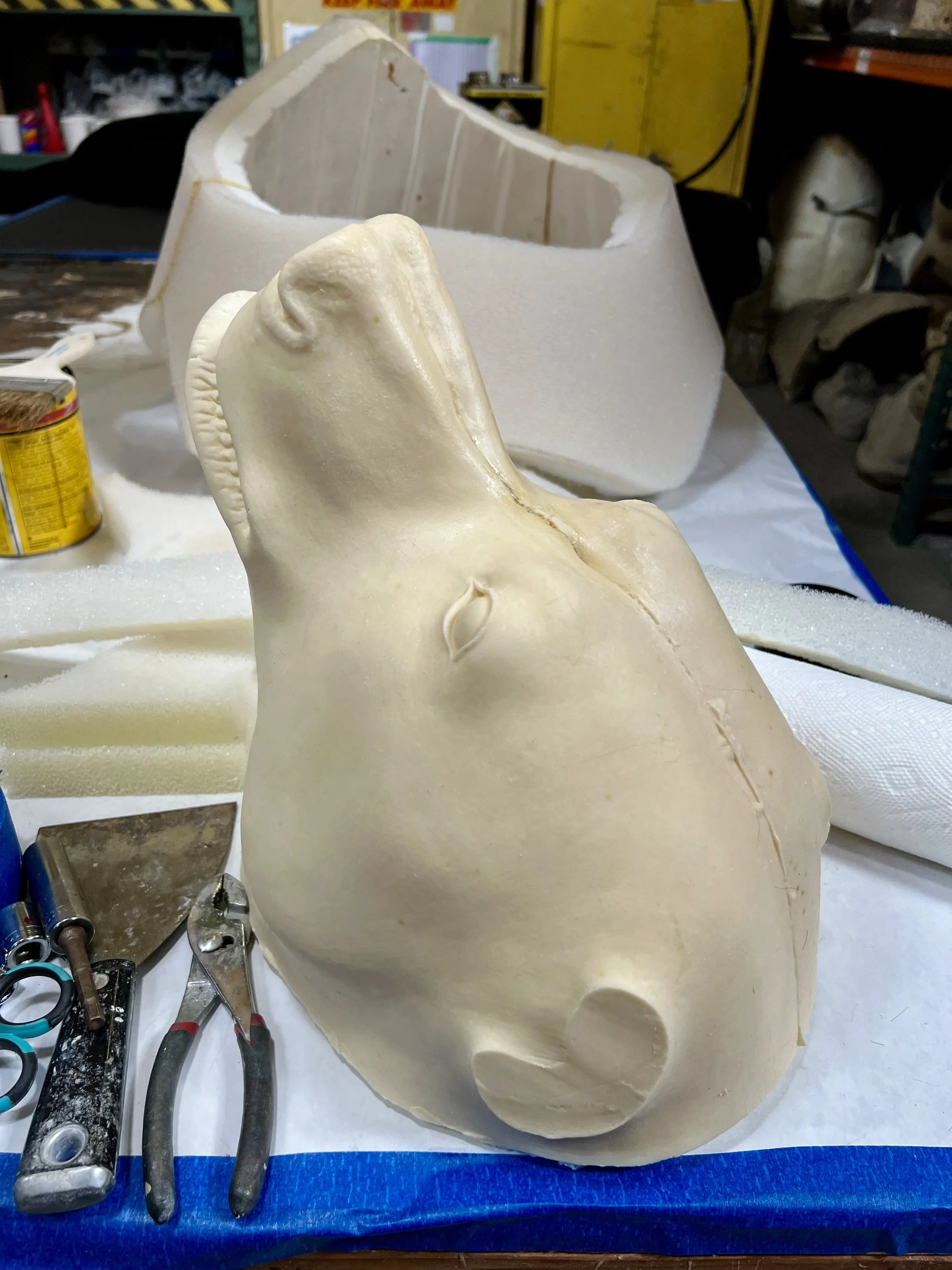Latex skin over lightweight urethane foam and a helmet