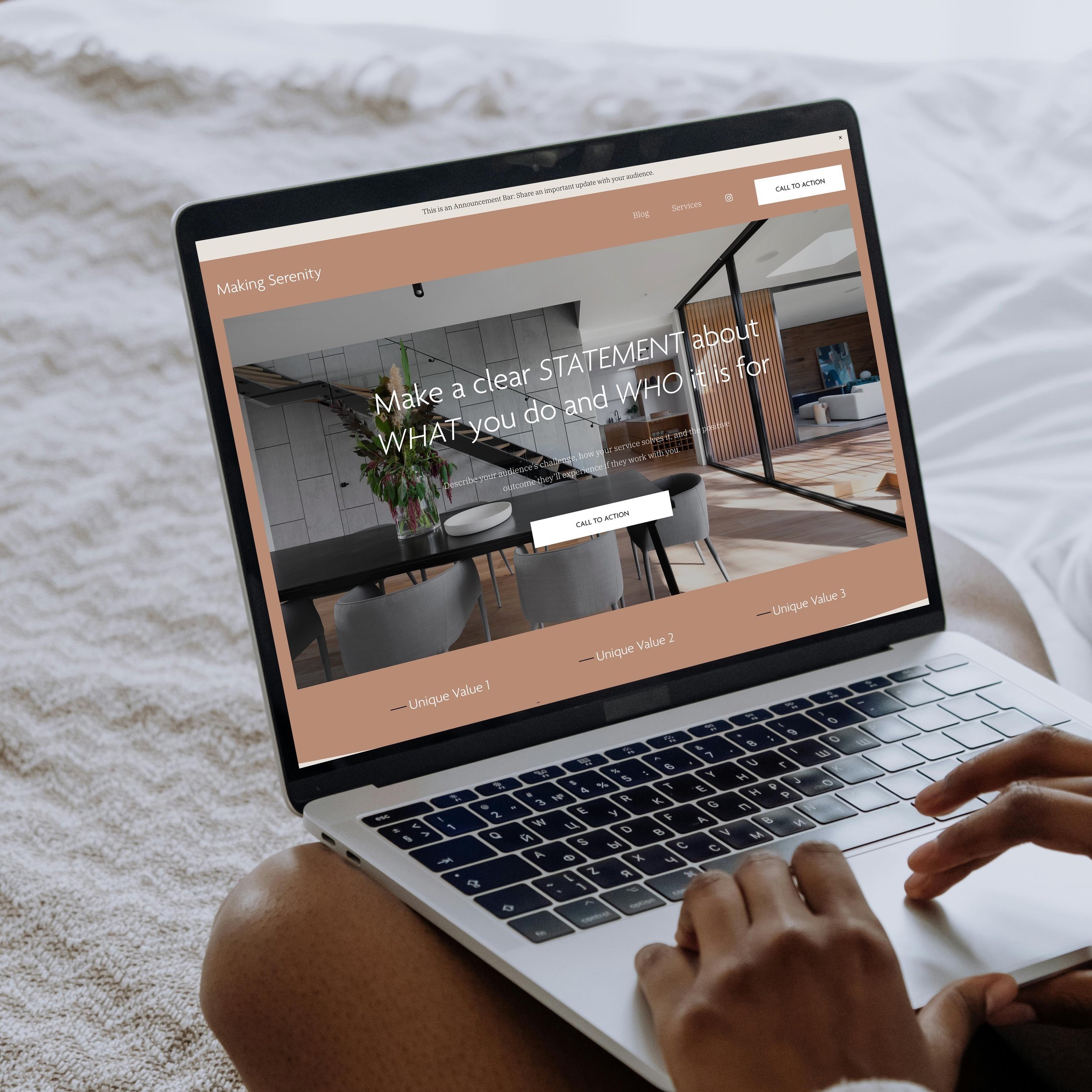 Laptop displaying a website with design and architecture theme, showing interior design photo, and text: 'Make a clear STATEMENT about WHAT you do and WHO it is for' with a call to action button.