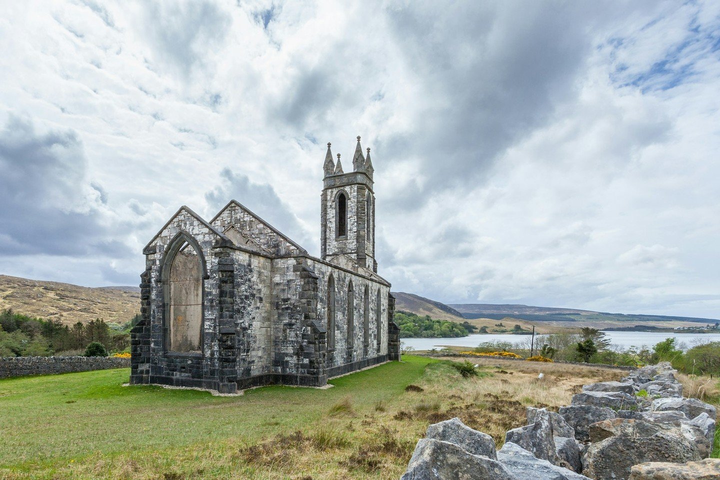 When we plan your trip to Ireland you&rsquo;ll want to step back in time and visit the enchanting Dunlewey Church in County Donegal. Built in 1853, this picturesque church boasts breathtaking views of Dunlewey Lough lade. #TravelIreland #HistoricSite