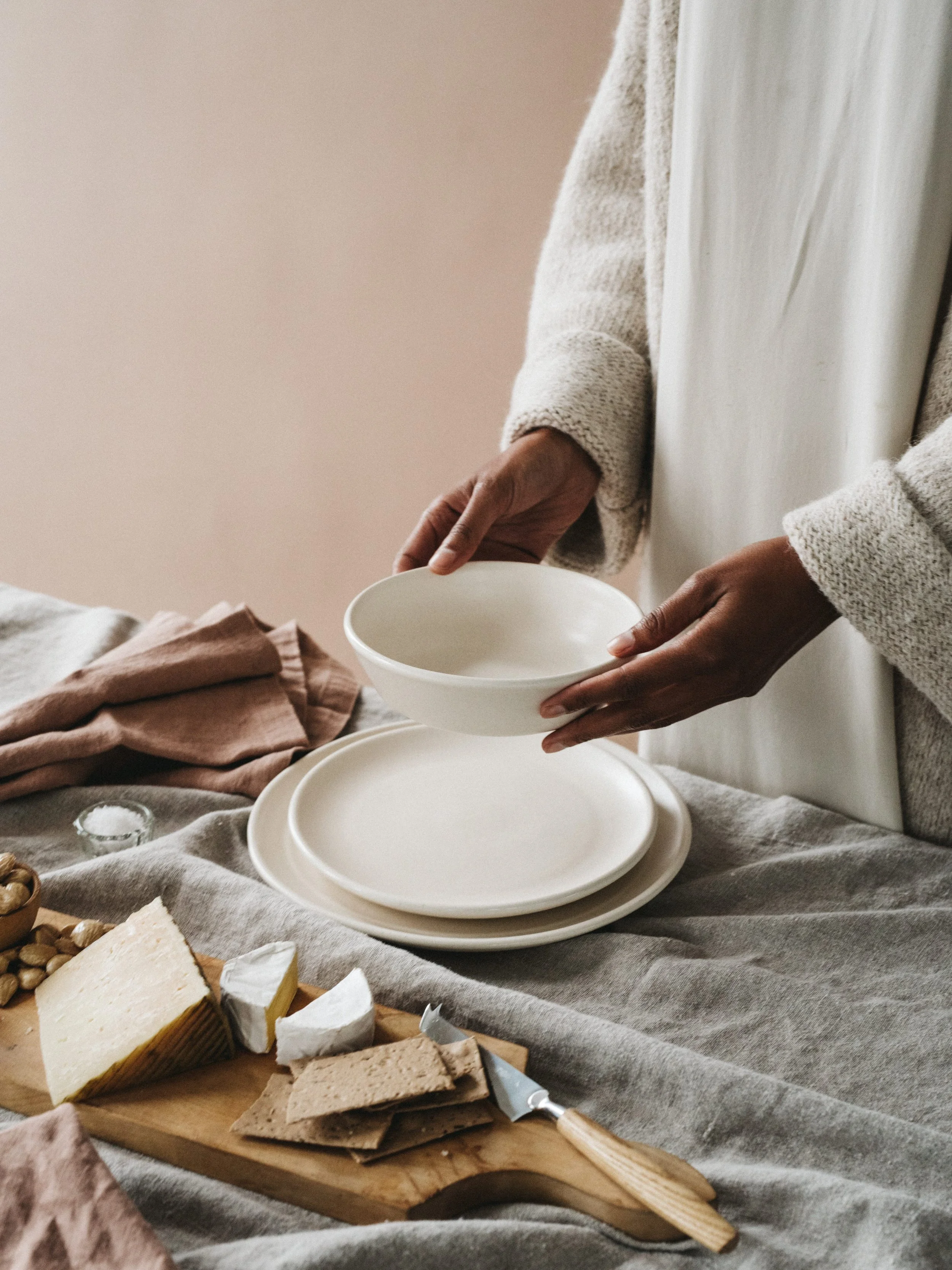 Couple building a Myrth porcelain dinnerware registry with mixed glazes
