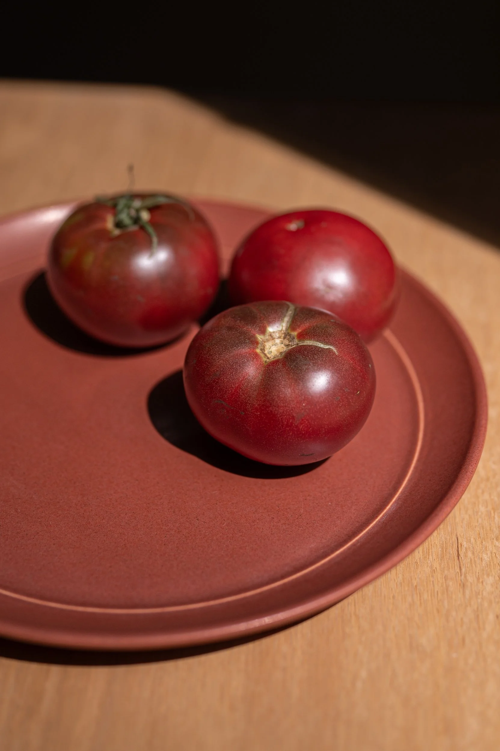 Rhode Island grown heirloom tomatoes on a Brandywine dinner plate.