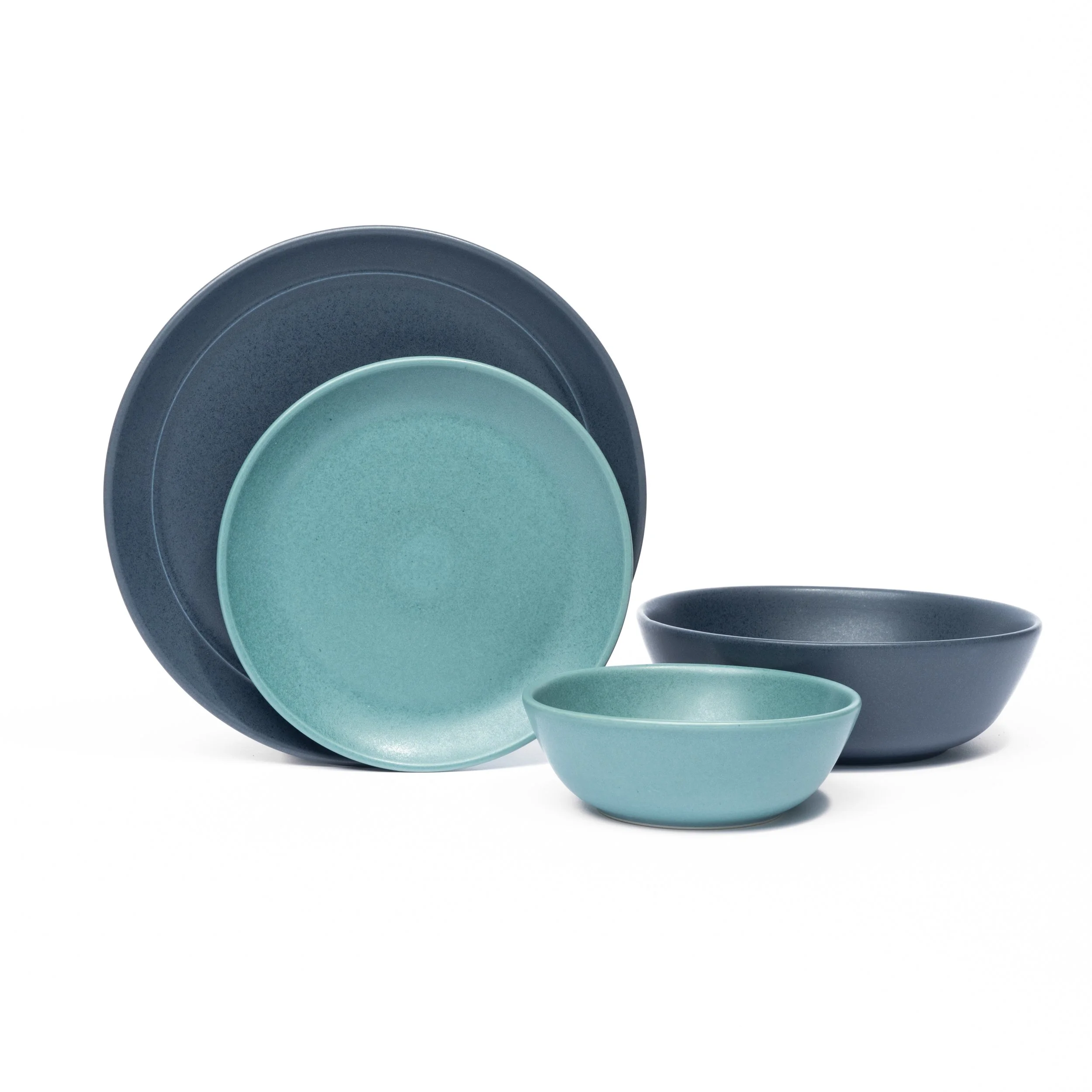 Myrth place setting mixing glazes by form, Nightfall dinner and appetizer plates with a Dove tasting bowl.