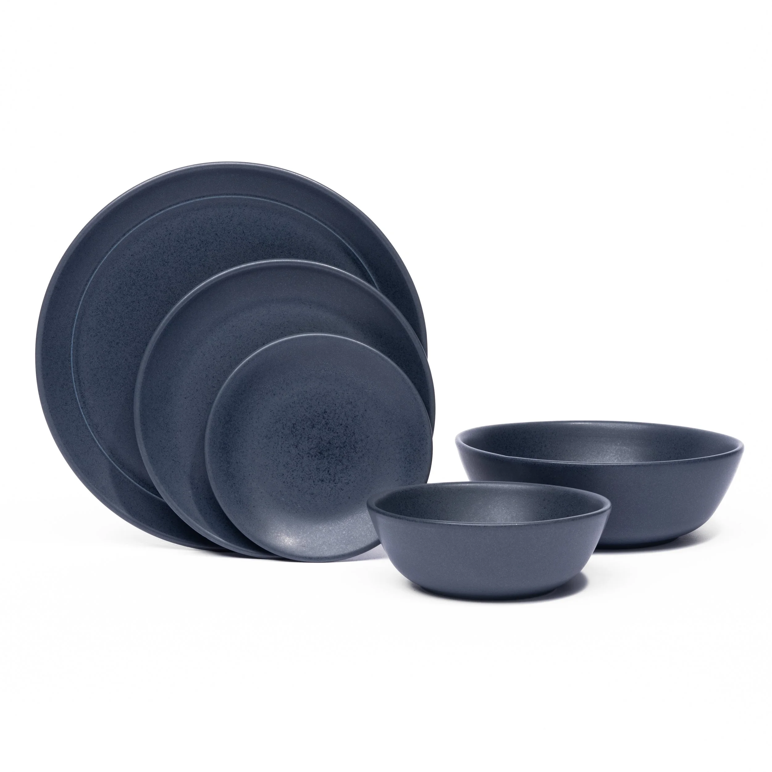 Myrth porcelain place setting in Nightfall, dinner plate, appetizer plate, and tasting bowl all in one glaze.