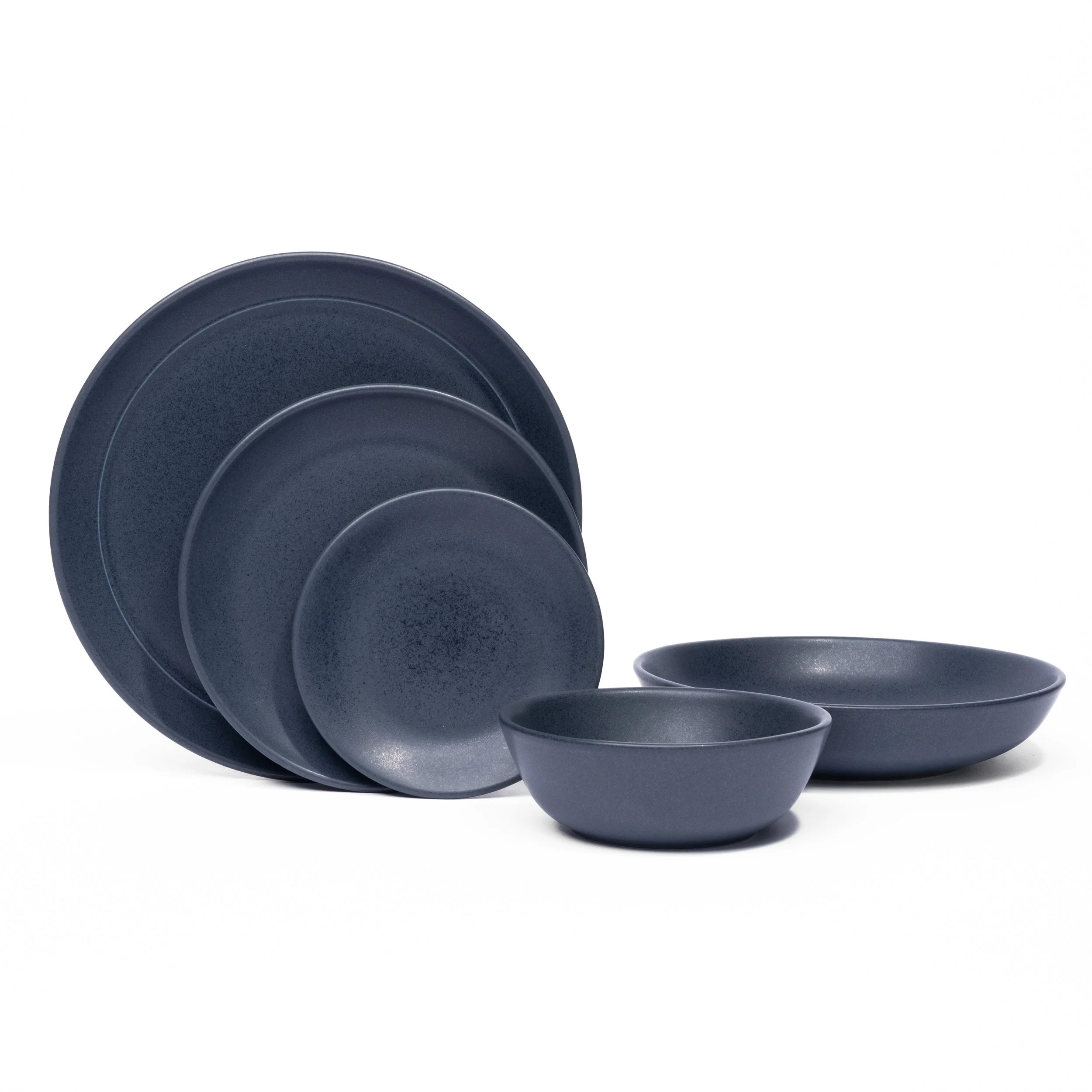 Myrth porcelain place setting in Nightfall, dinner plate, appetizer plate, and tasting bowl all in one glaze.