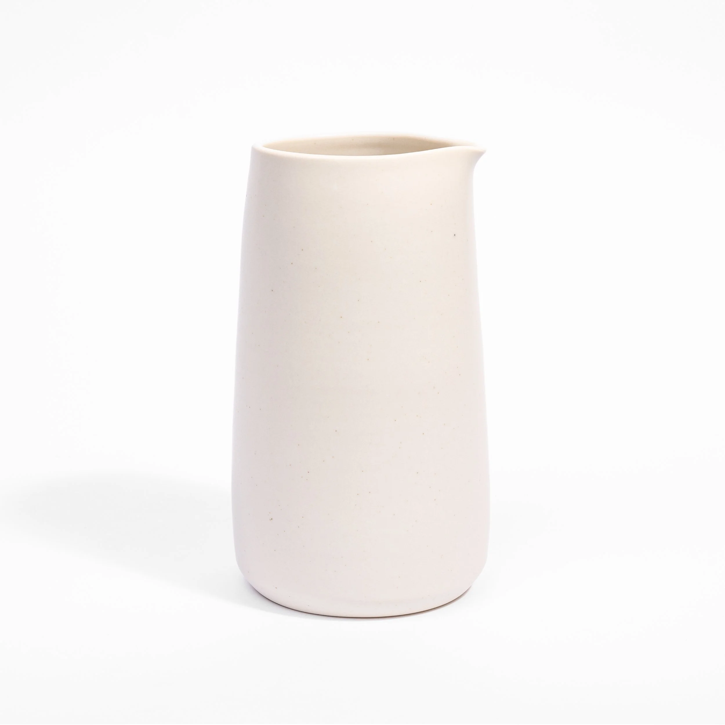 Handcrafted porcelain carafe shown in Moonlight glaze, Myrth Ceramics