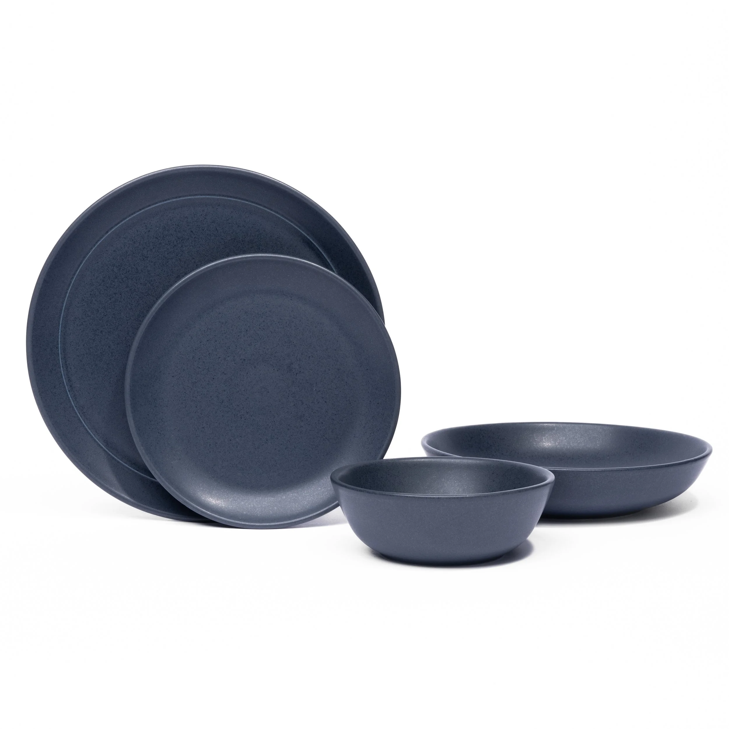 Myrth porcelain place setting in Nightfall, dinner plate, appetizer plate, and tasting bowl all in one glaze.