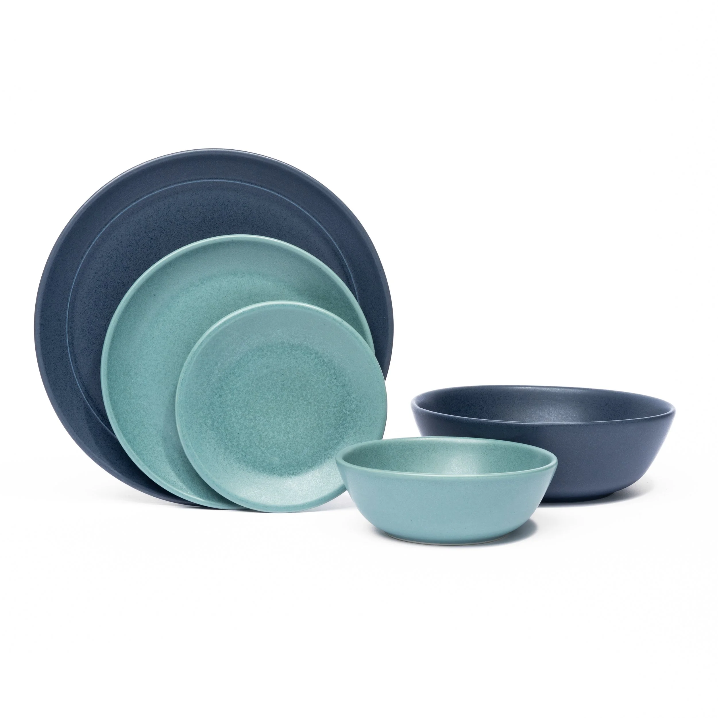 Myrth place setting mixing glazes by form, Nightfall dinner and appetizer plates with a Dove tasting bowl.