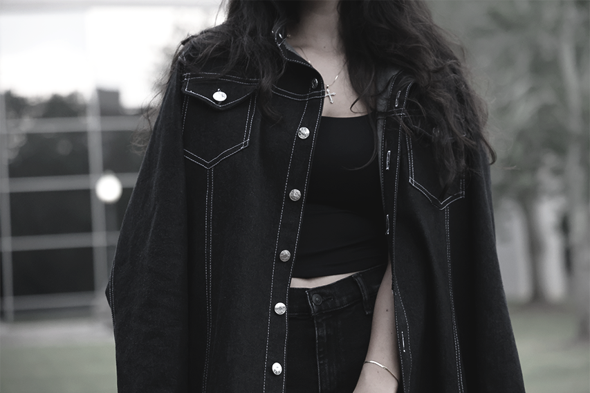 Close up shot of young lady wearing a VRTY coat