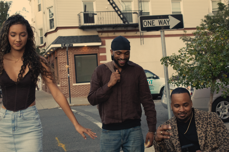 Candid photo of models talking on street corner