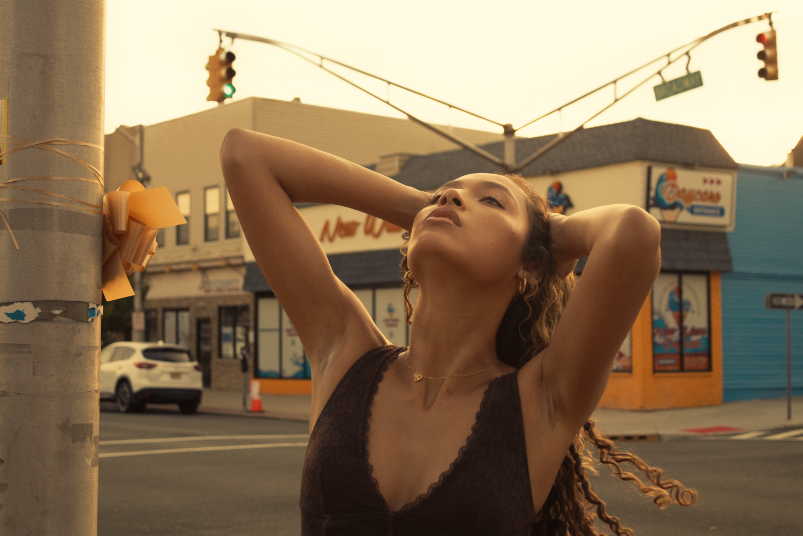 Model posing in street intersection
