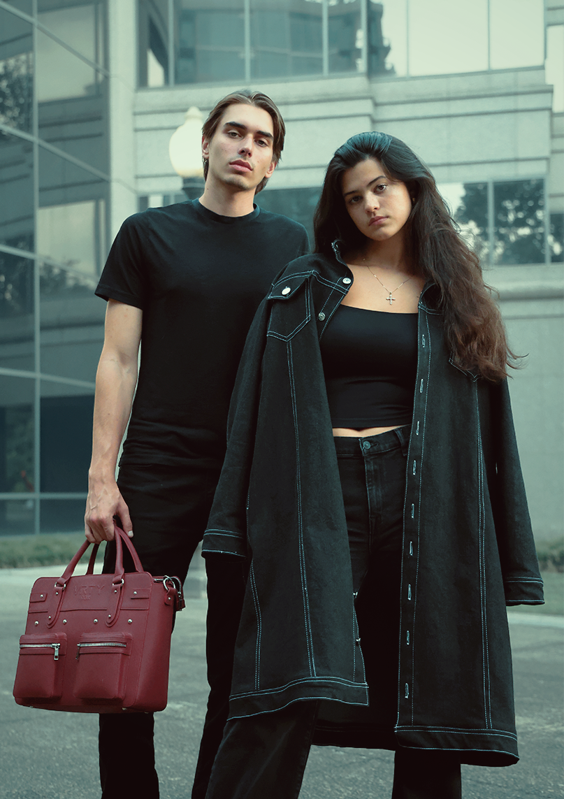 Young couple wearing VRTY clothing standing in urban center